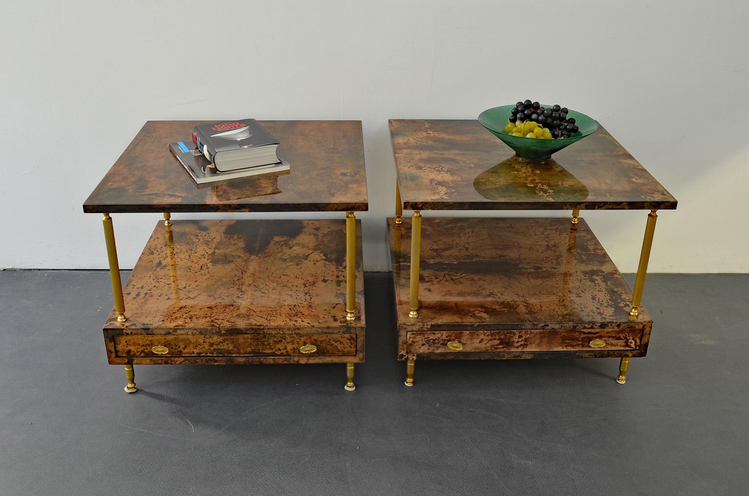 A set of two nightstands / side tables / nesting tables by Aldo Tura for Tura Milano, Italy, 1960s midcentury.
The color of both is brown and the material is goatskin and brass.
Every nightstand has a drawer.