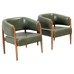 2 oak and green leather lounge chairs