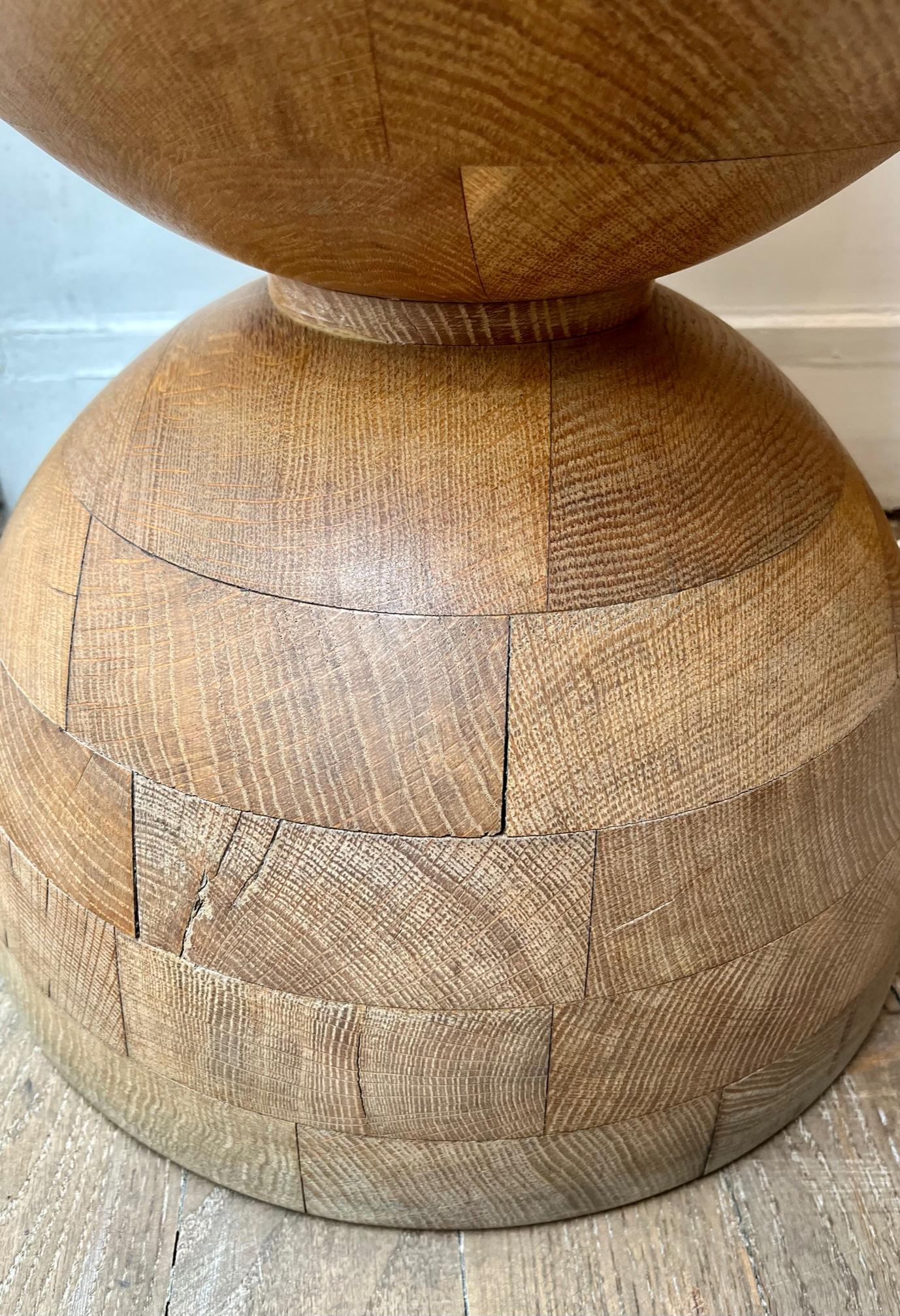 A pair of 2 oak stools
Made of oak blocks tightly assembled ( see detail photo ). 
The craftsmanship of these stools shows great skill and accuracy of adjustment. Made on order for restaurant in the South of France.
 Although these pieces are