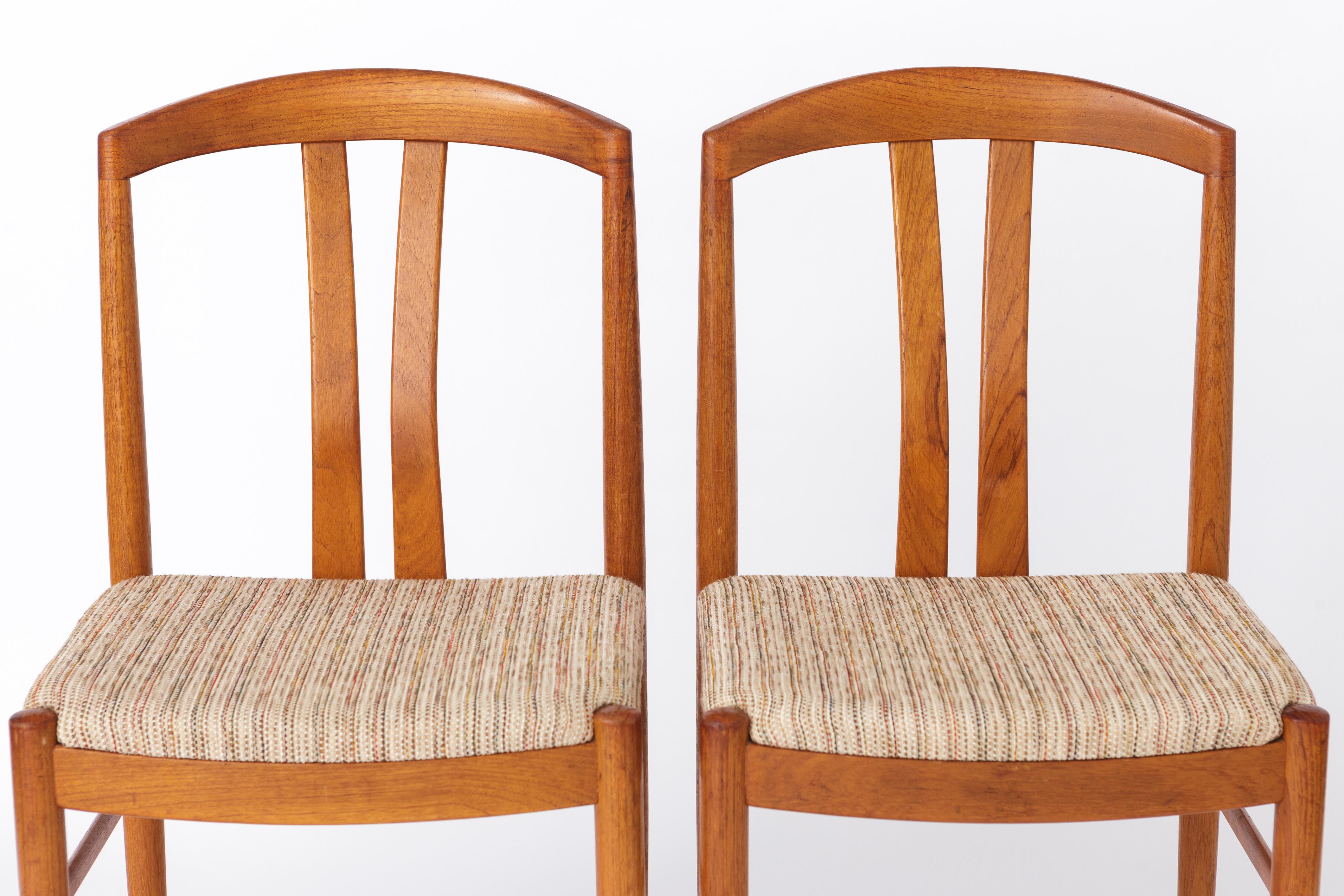 Pair of midcentury chairs made by Johansson & Söner, Sweden. 
Design by Carl Ekström in the 1960s. 
Displayed price is for a pair. Totally up to 6 available. 

Good vintage condition. Sturdy teak frames. Original textile upholstery. 
The corners of