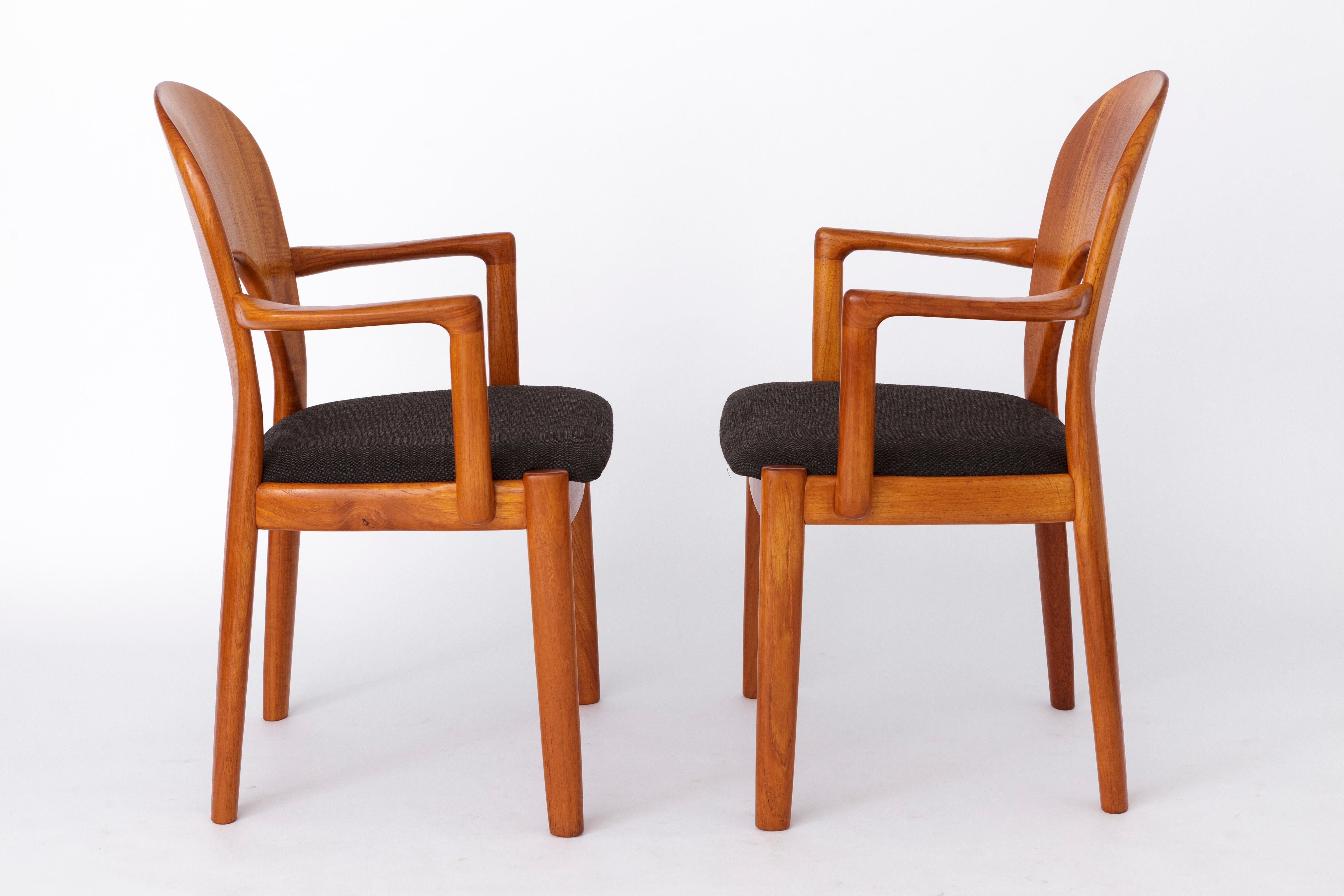 2 Armchairs by Niels Koefoed, Denmark. 
Production period: approx. 1960s-1970s
Displayed price is for a pair. Totally 4 chairs (2 pairs) available. 

Sturdy teak wood frame. Refurbished and oiled. 
Reupholstered seat covers with black textile.