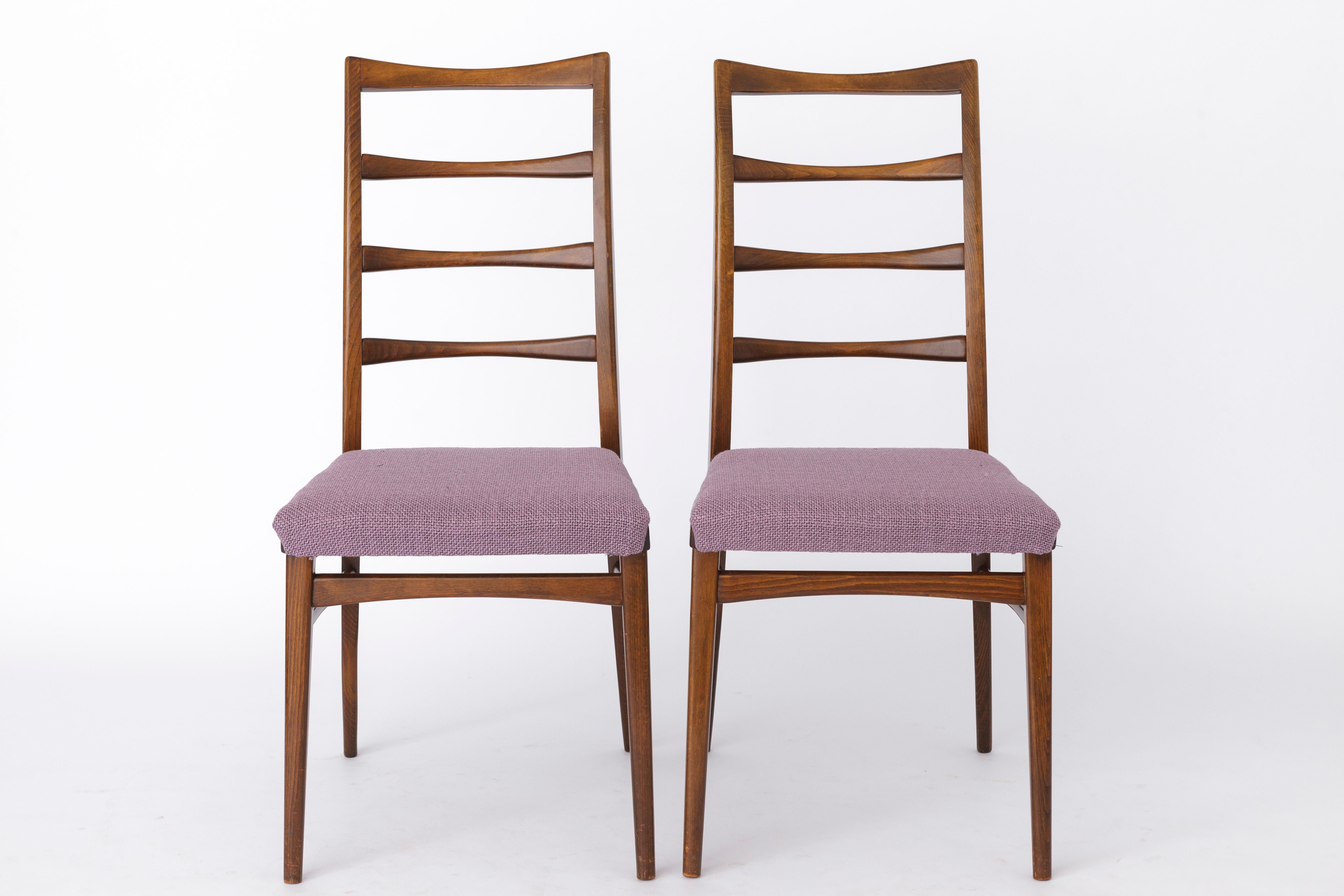 2 Vintage chairs. German origin. 
Production period: approx. 1950s-1960s. 
Unknown designer or manufacturer. 
Displayed price is for a pair. Totally up to 6 chairs (3 pairs) available. 

Sturdy dyed beech wood frame. Refurbished and oiled.