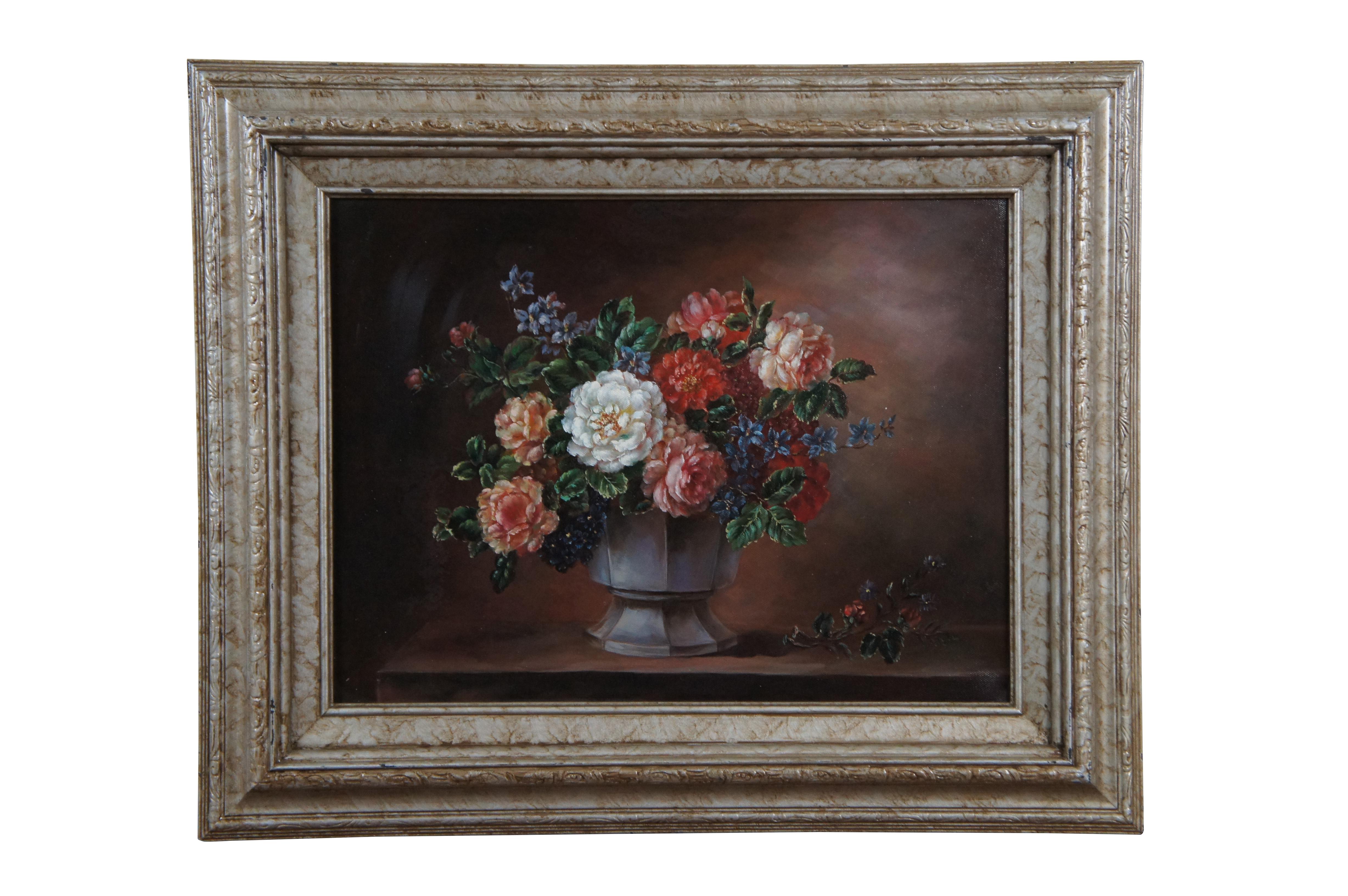Pair of late 20th century hand painted oil on canvas still life paintings depicting bouquets of assorted flowers in vases. No signatures. Framed in marbled champagne frames with lightly carved raised bevels.

Dimensions:
21.75