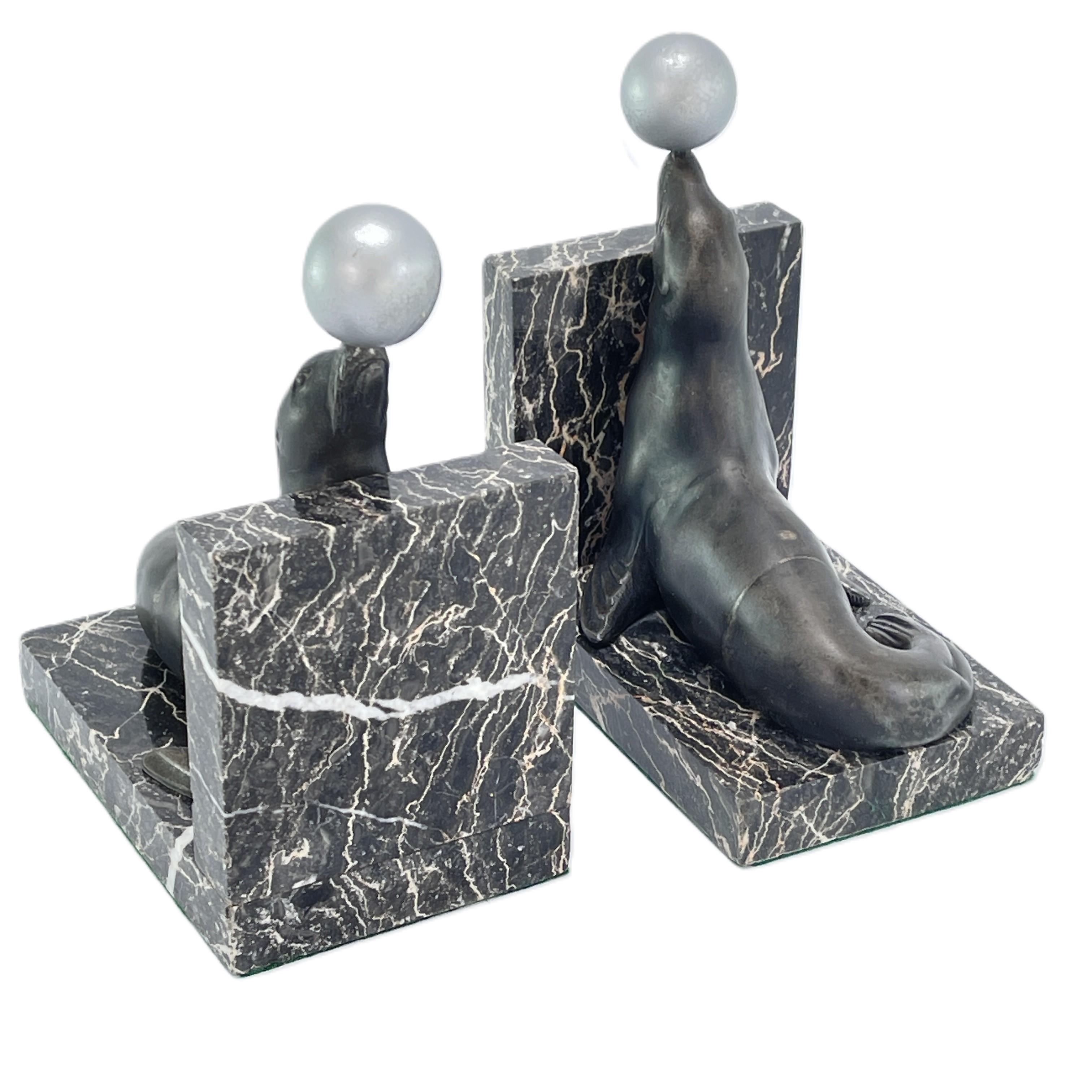 French 2 original ART DECO bookends with sea lions on a marble base, 1930s For Sale