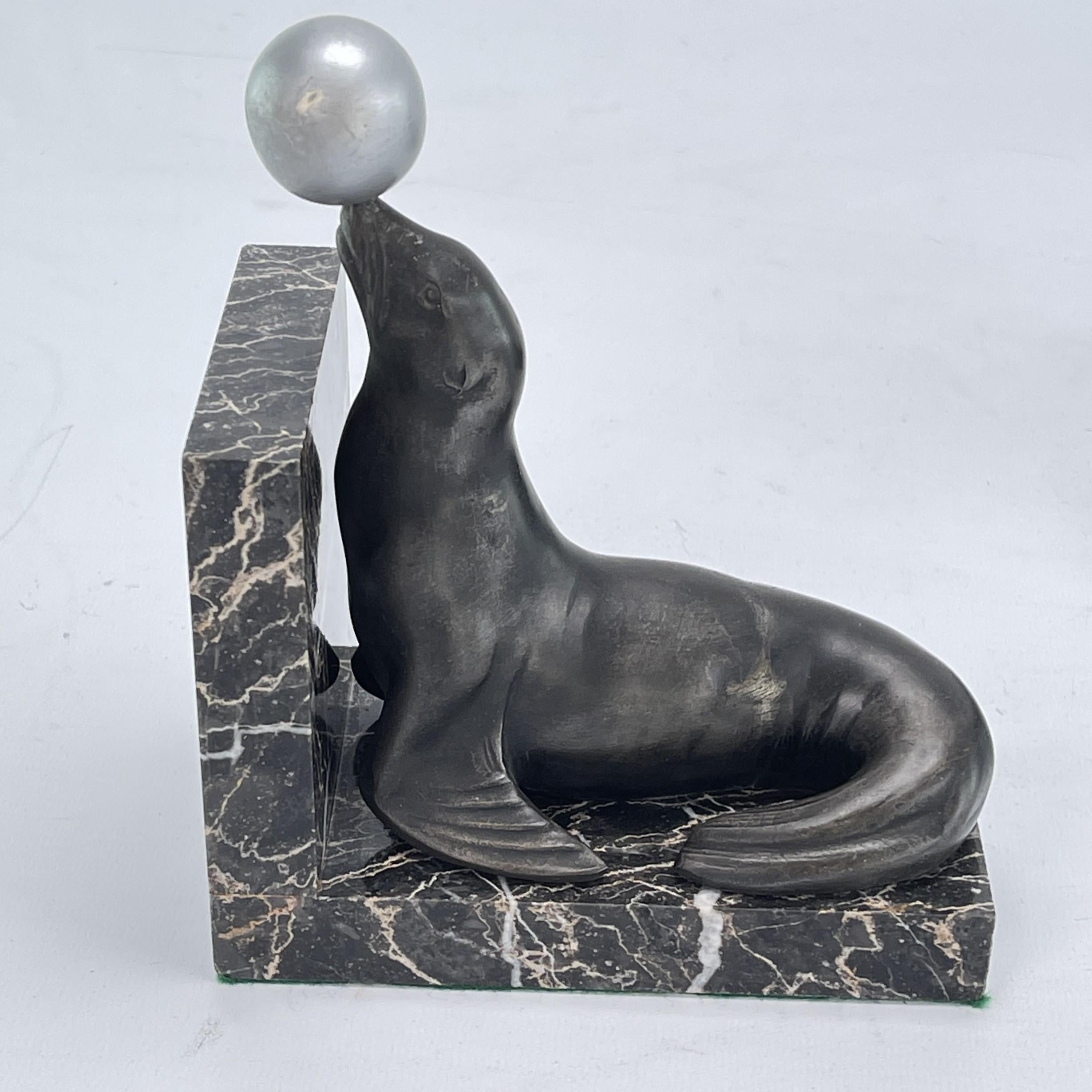 Mid-20th Century 2 original ART DECO bookends with sea lions on a marble base, 1930s For Sale
