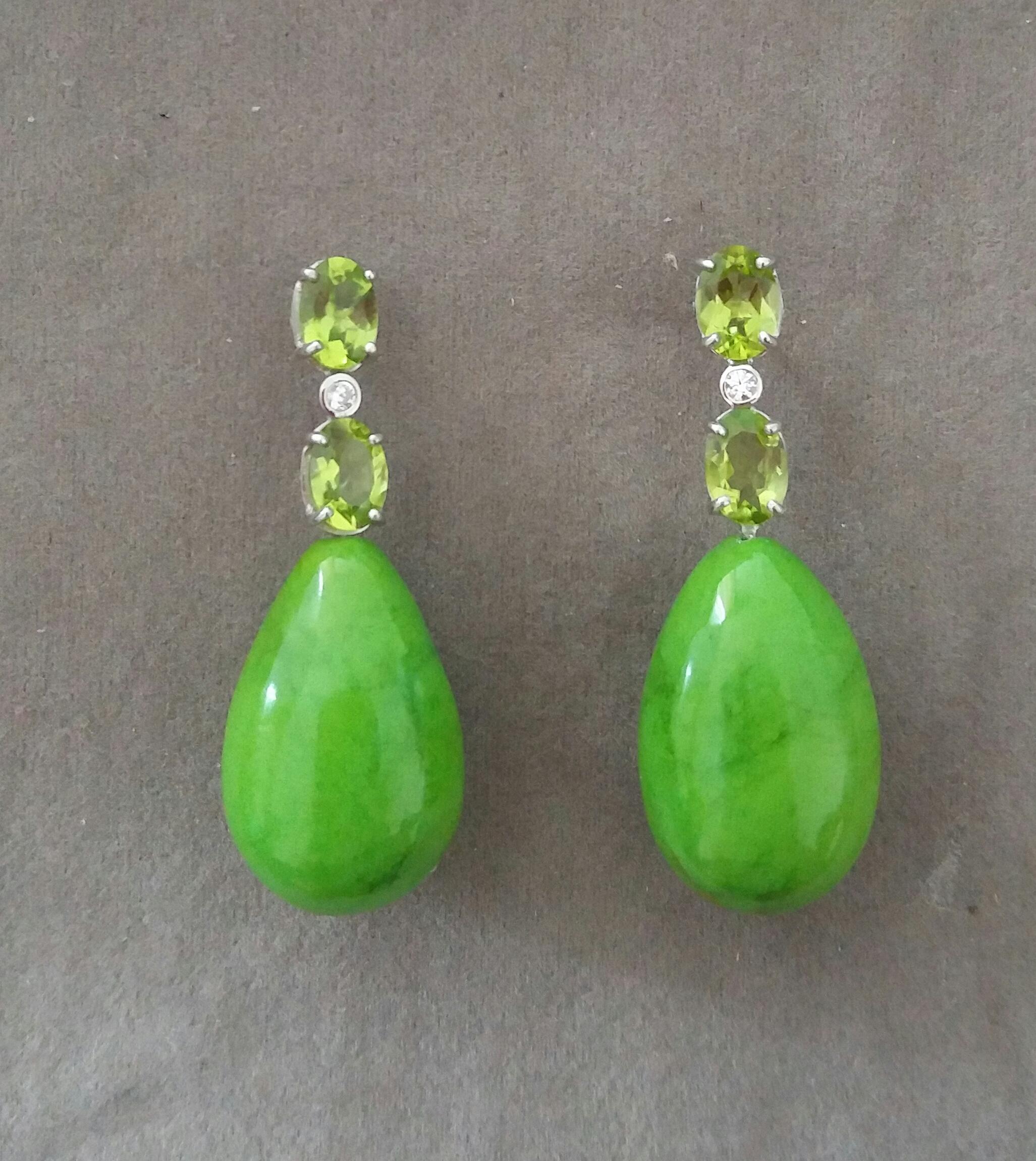 Elegant and completely handmade Earrings consisting of an upper part of 2 oval shape Faceted Peridot of 5 mm x 7 mm set together in 14 Kt white gold with a  small diamond in the middle, at the bottom 2 Green Turkmenistan  Turquoise Plain Round Drops