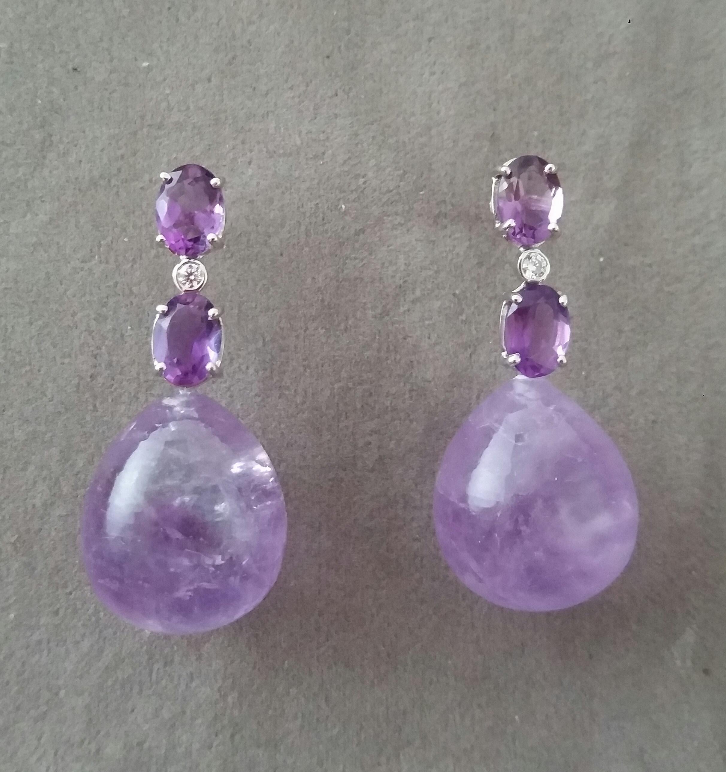 Elegant and completely handmade Earrings consisting of an upper part of 2 oval shape Faceted Amethyst of 5 mm x 7 mm set together in 14 Kt white gold with a  small diamond in the middle, at the bottom 2 Plain Round Amethyst Drop Earrings measuring