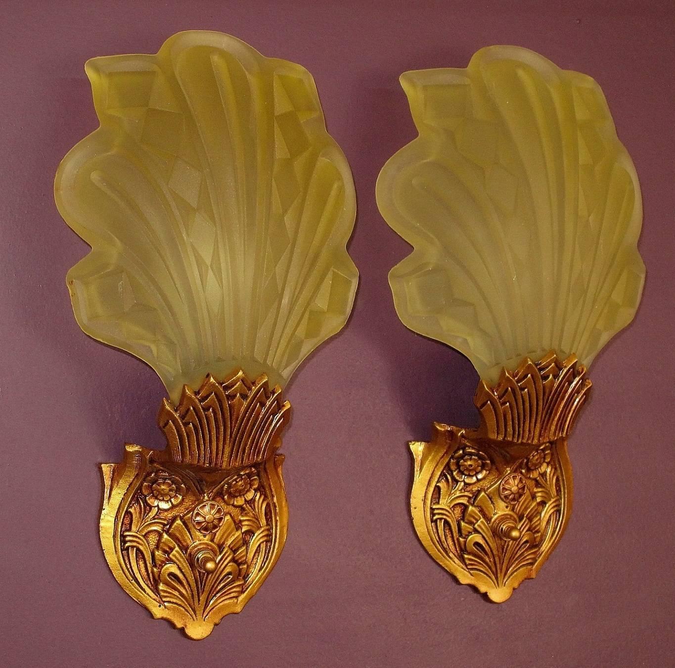 2 pair available, priced per pair.
Rather rare and interesting pair of Art Deco era slip shade wall sconces. The designers here were able to capture the feeling of leaves blowing in the wind with the swept back and flowing nature of the shades