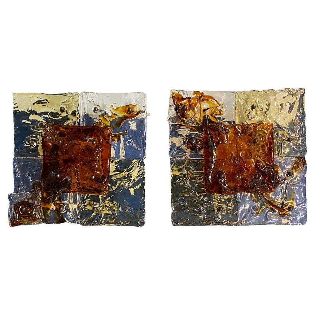 One pair of elegantly designed and documented glass sconces by famous Italian designer Tony Zuccheri for Venini circa 1970. Origianly two pair available. Only one pair now for sale. Each patchwork style sconces consists of four 6
