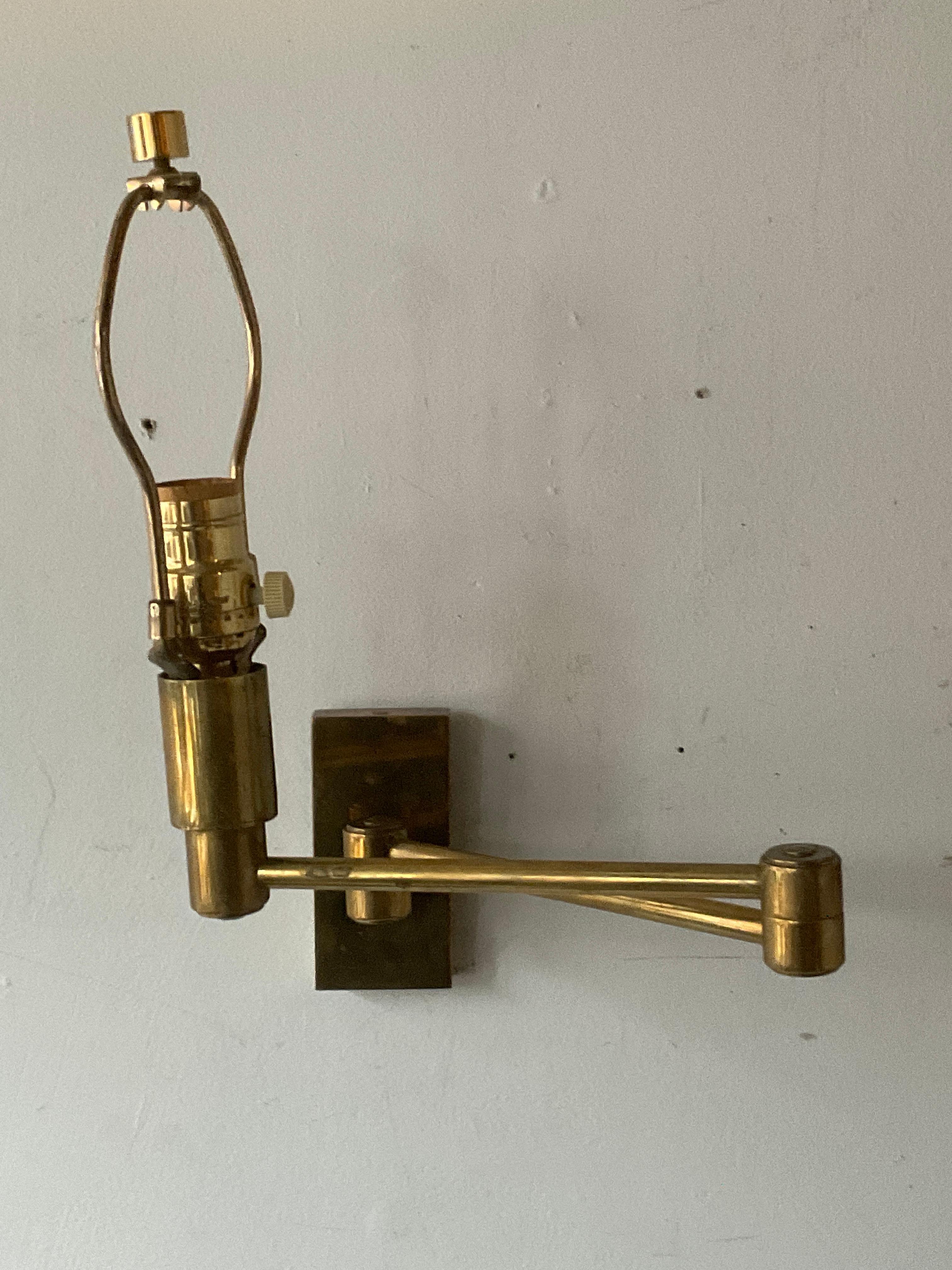 A pair of solid brass swing arm sconces. Nice weight, good quality.