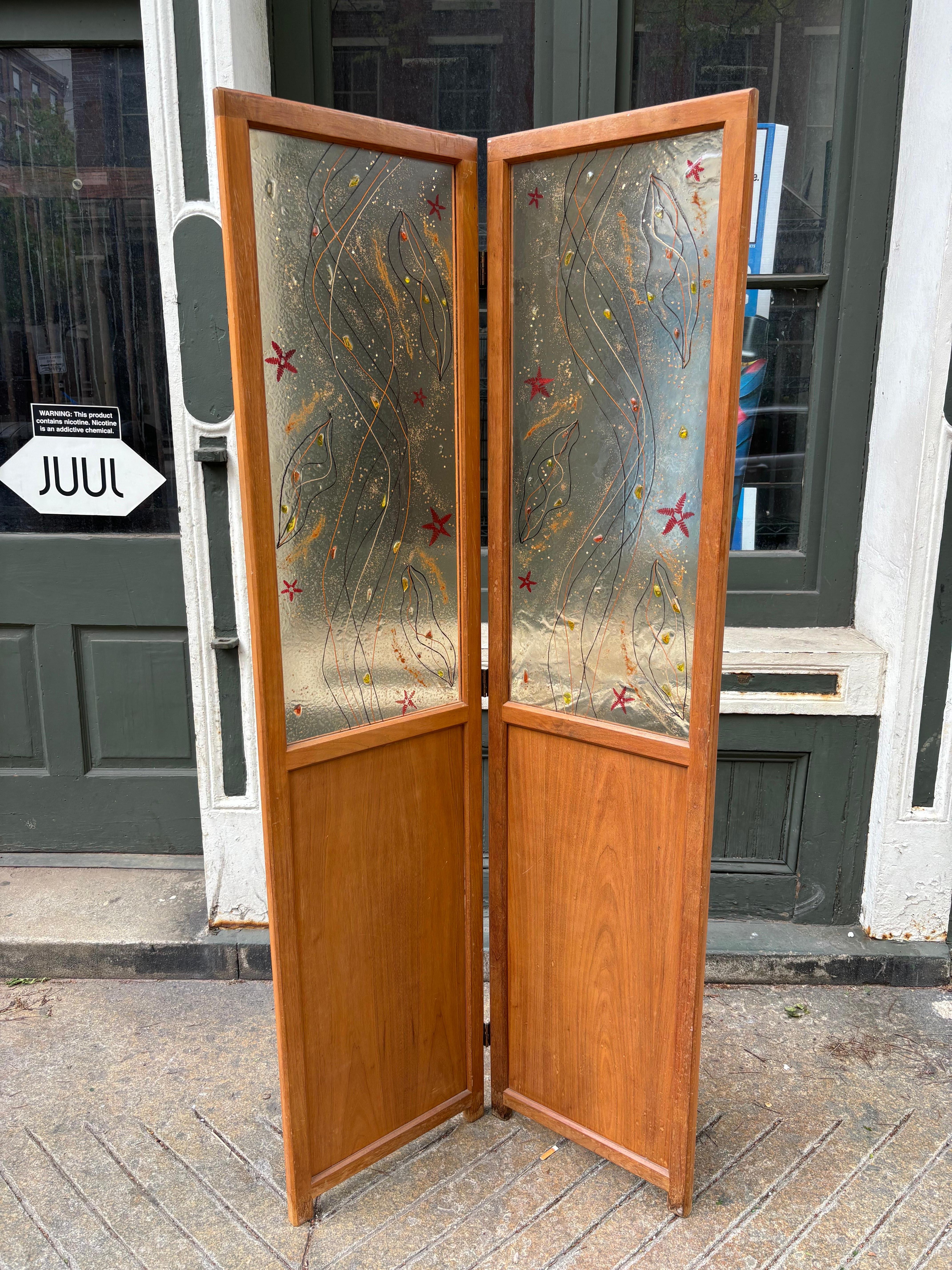 Two Panel Wood Screen with caning on bottom of one side.  Top is an abstract design of fern leaves and threads laid out in a free-form design in lucite panels.  Panels have the look of Higgins Glass.  Overall in nice original condition.  Perfect to