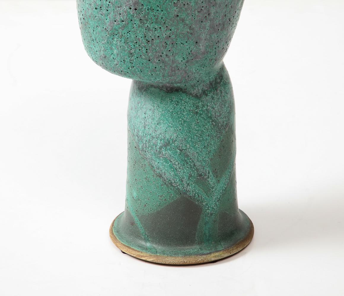 Ceramic floating bowl with green glazes. Artist signed on underside.