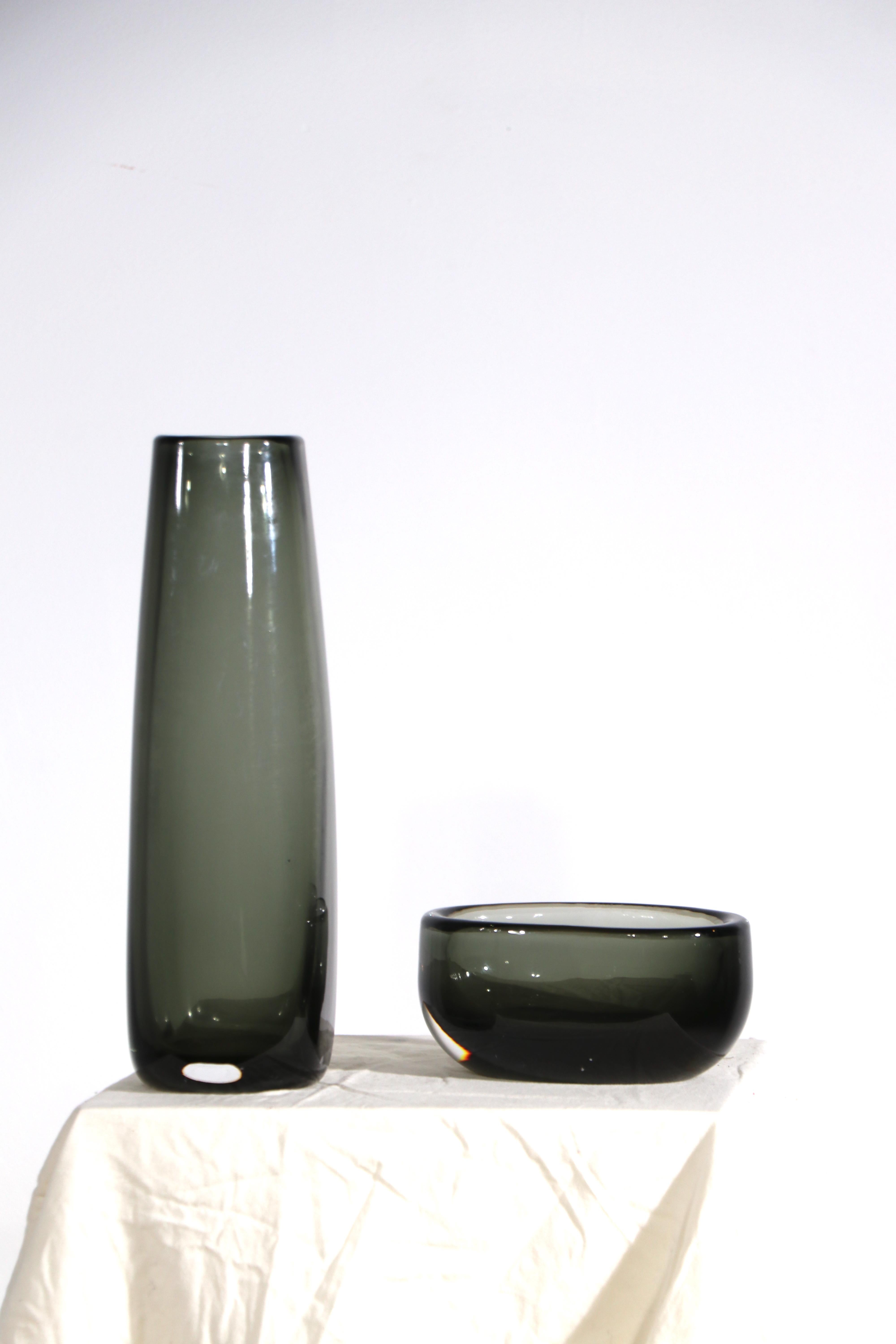 2 pc. Mid Century Art Glass vases by Nils Landberg for Orrefors. Both are in excellent condition free of damage , both are fully and correctly marked. Offered and priced as a lot of two. 
 Smaller piece:
5.75 W x 3.5 D x 2.75 H
 Taller Vase:
3 W