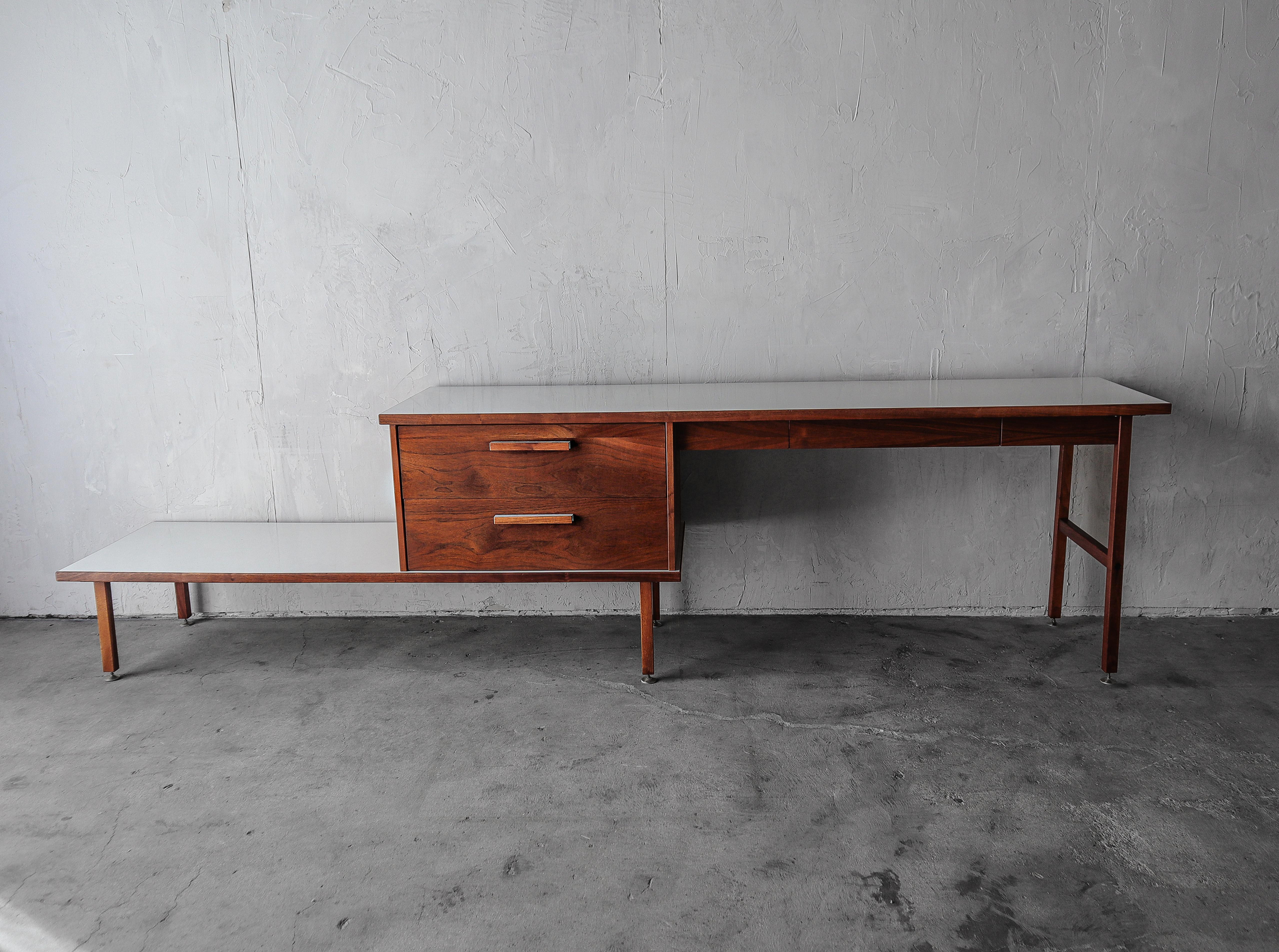 This authentic mid century original is the perfect multitasking furniture piece where space is minimal but function is necessary.  This piece is perfect ran along a wall where its footprint is so minimal, but the amount of functionality it provides