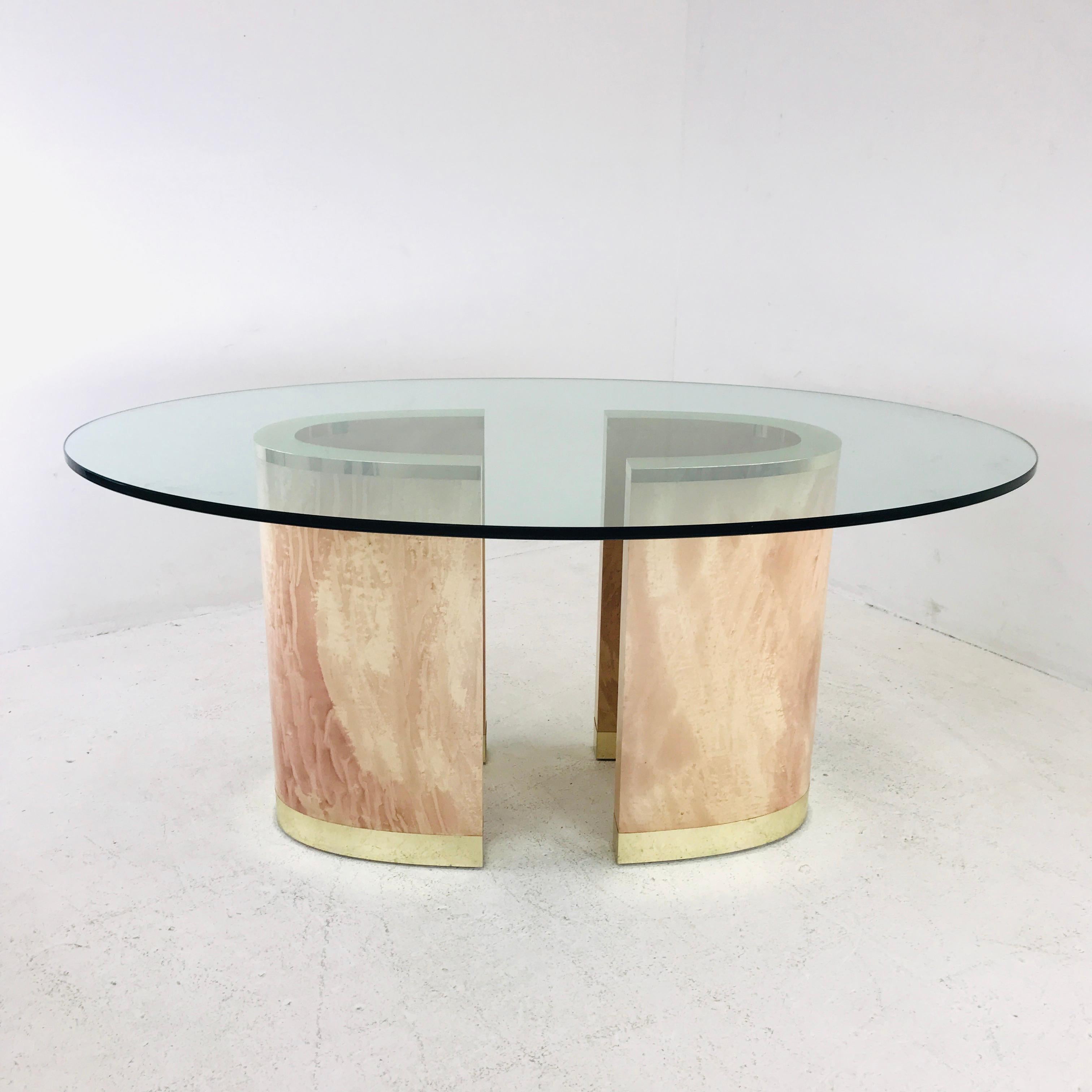 Stunning 1980s 2 piece pedestal base dining table with oval glass top. Unique pair of wood/faux finish pedestal bases can be reconfigured for the desired arrangement. Oval top has chip at one edge. Glass measures 68