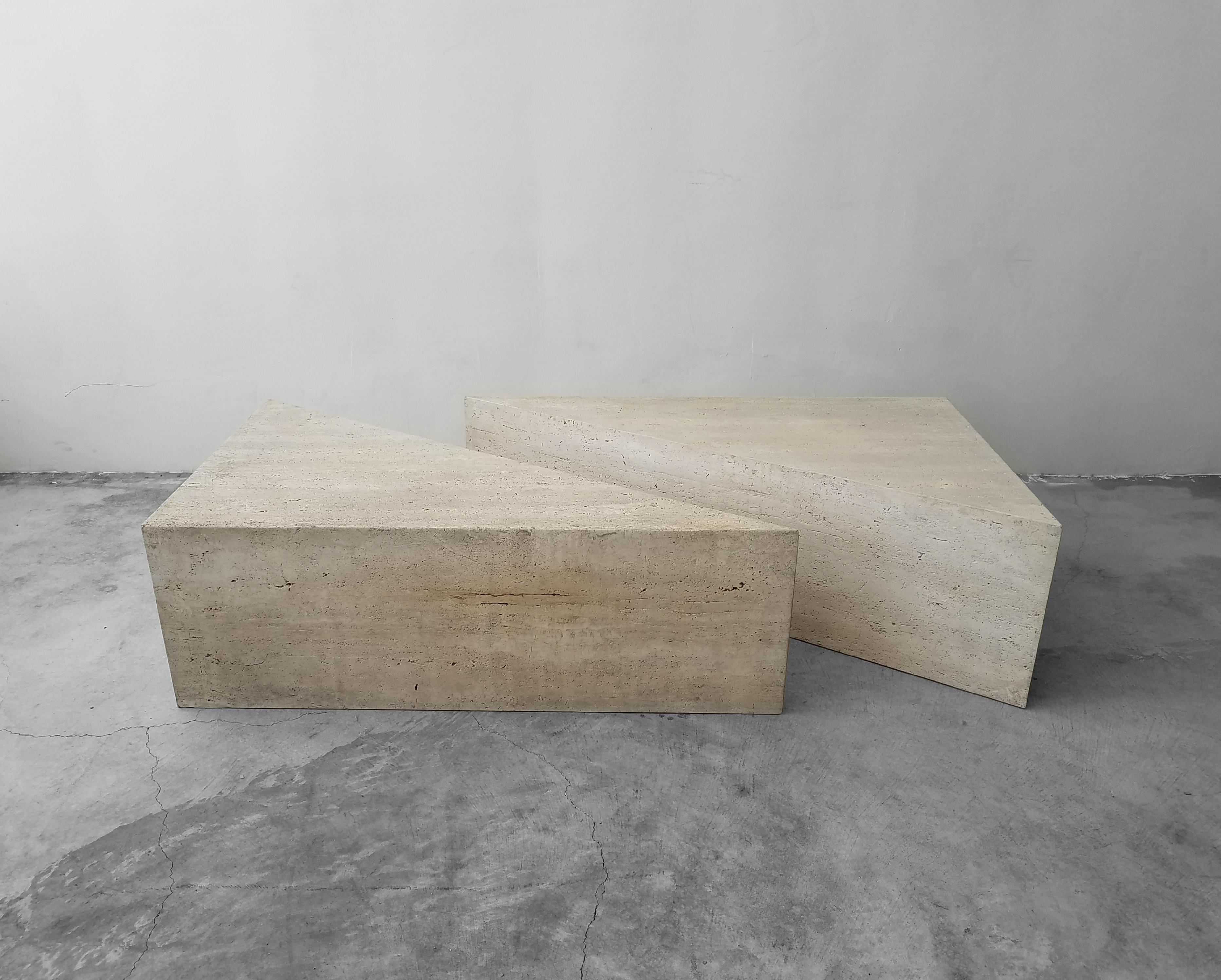 Classic Postmodern Italian travertine coffee table. Simple beautiful piece. Table is of modernist and minimal design, comprised of 2 triangular tables, identical in size and height, they can be configured in any manner, the options are