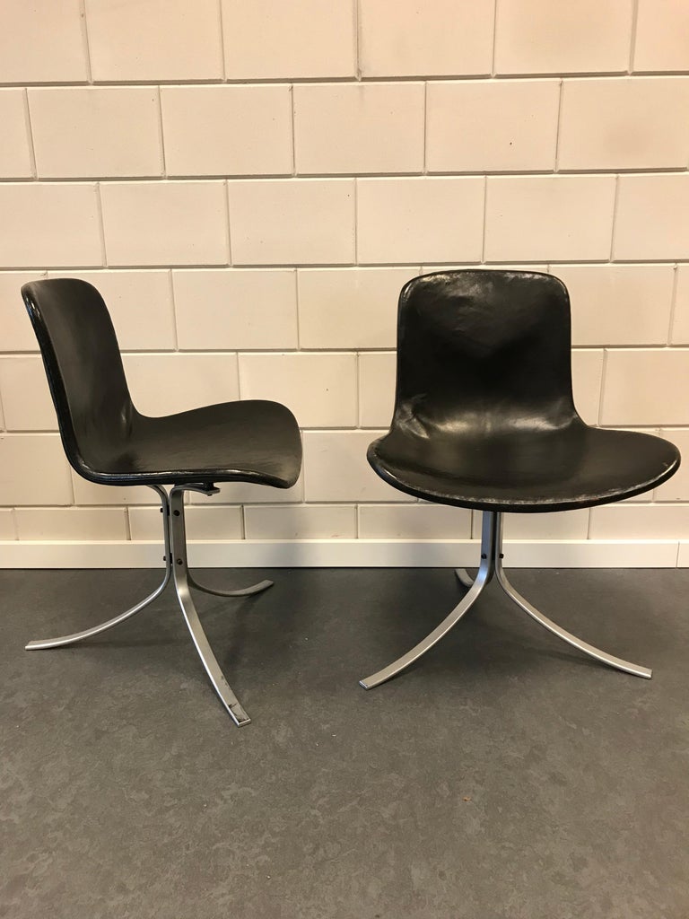 Two early PK9 black leather dining chairs design 1961 by Poul Kjaerholm for Kold Christensen
chairs are in good condition.