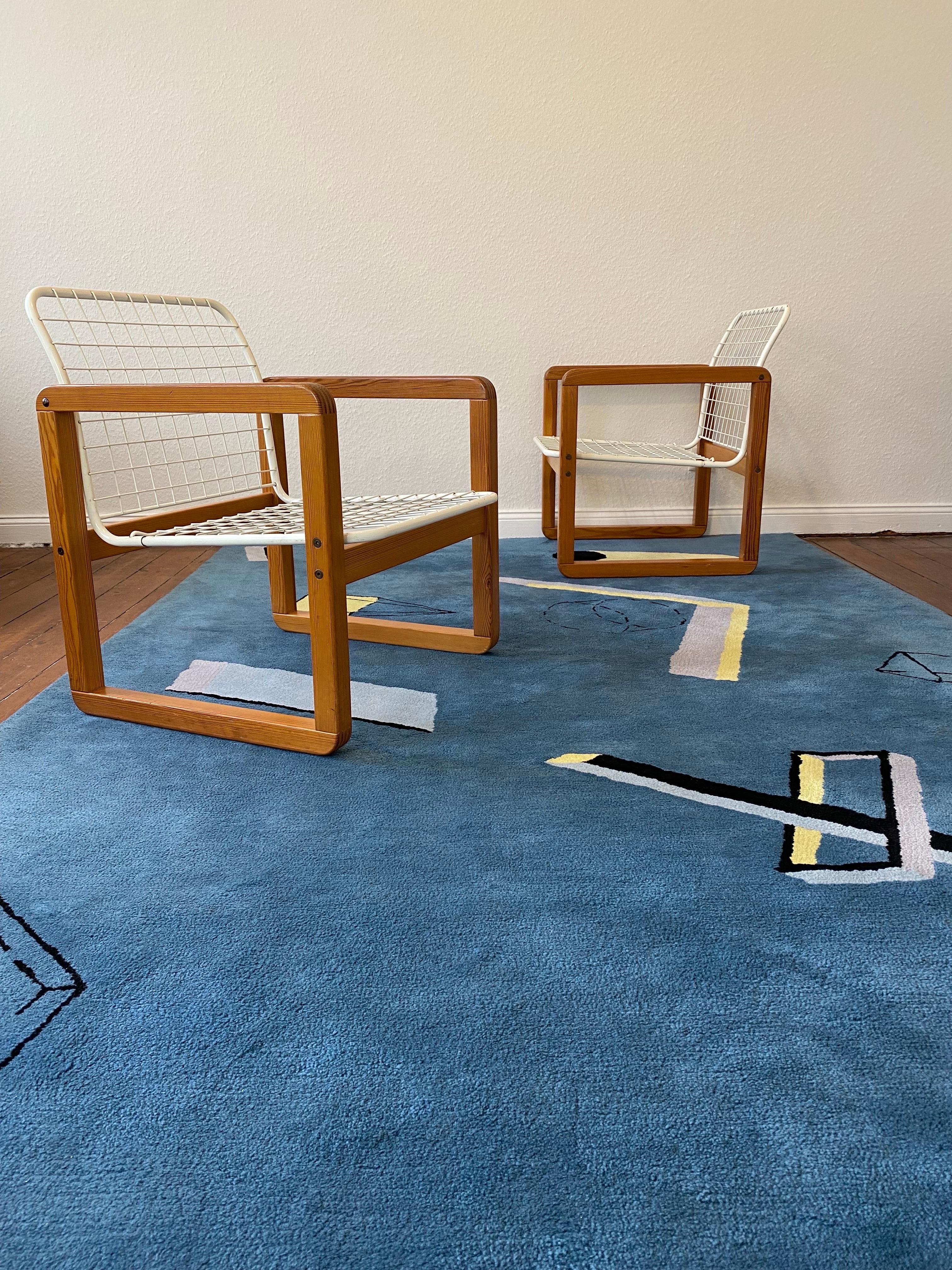A Pair of  Postmodern Ikea  Chairs , model : SÄLEN ,designed by K.&M. Hagberg , Sweden 1982.
Made of Pine Wood and Steel with the rare and often missing washable  removable inner-cushions upholstery in good original condition.
This Version , rare in