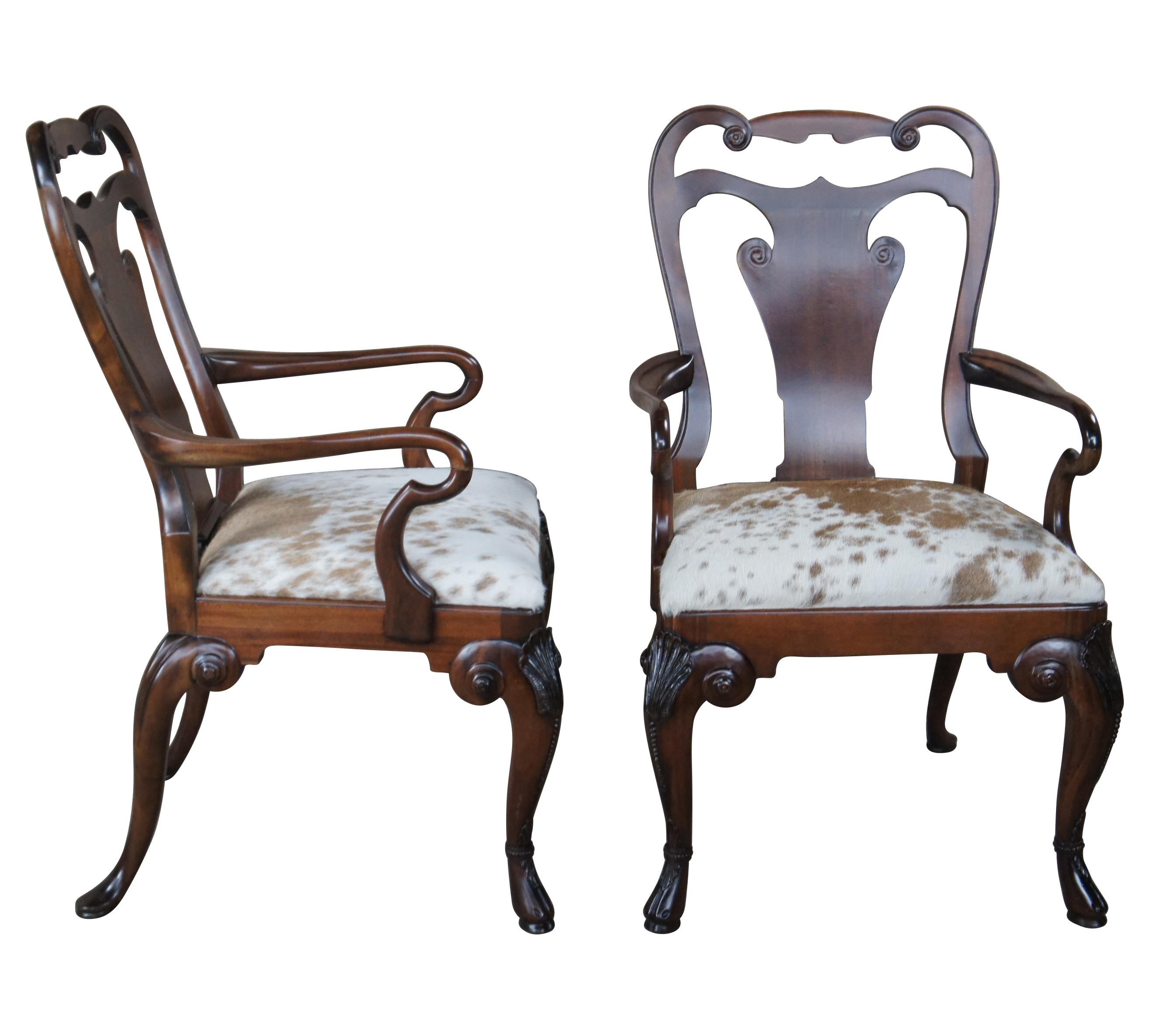 An exceptional pair of Vintage Ralph Lauren Henredon Beekman dining arm chairs. Made from mahogany in George II styling with serpentine pierced shoulder, vase shaped back, legs are crowned with carved shells and rest on hoof feet, while the rear