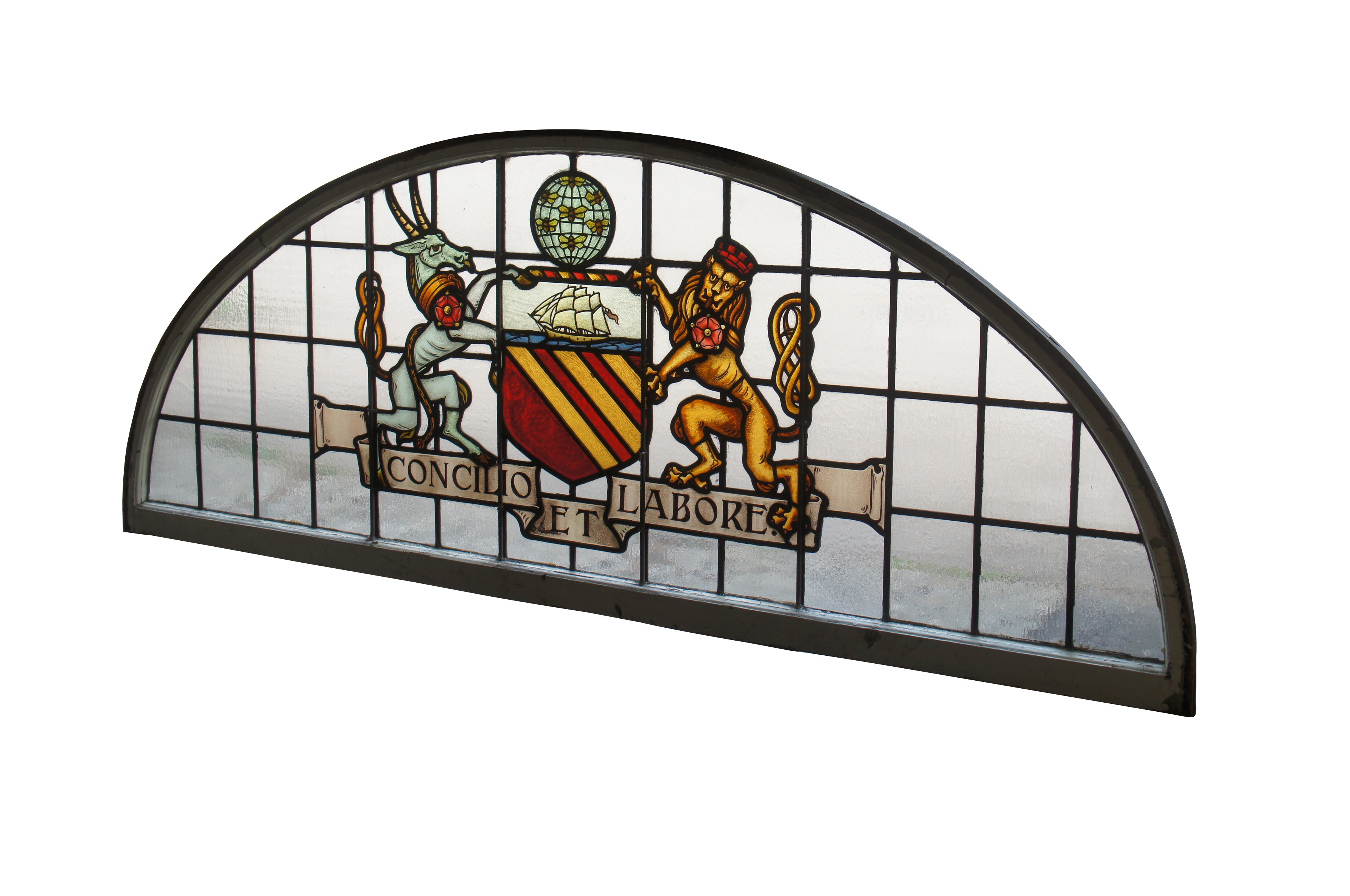 A fantastic very large pair of exceedingly rare leaded stained glass Palladian window panels, circa late 19th century.  Features the Manchester England Coat of Arms, aptly titled 'Concilio et Labore' translated to 'By Counsel and Work' or 'Wisdom