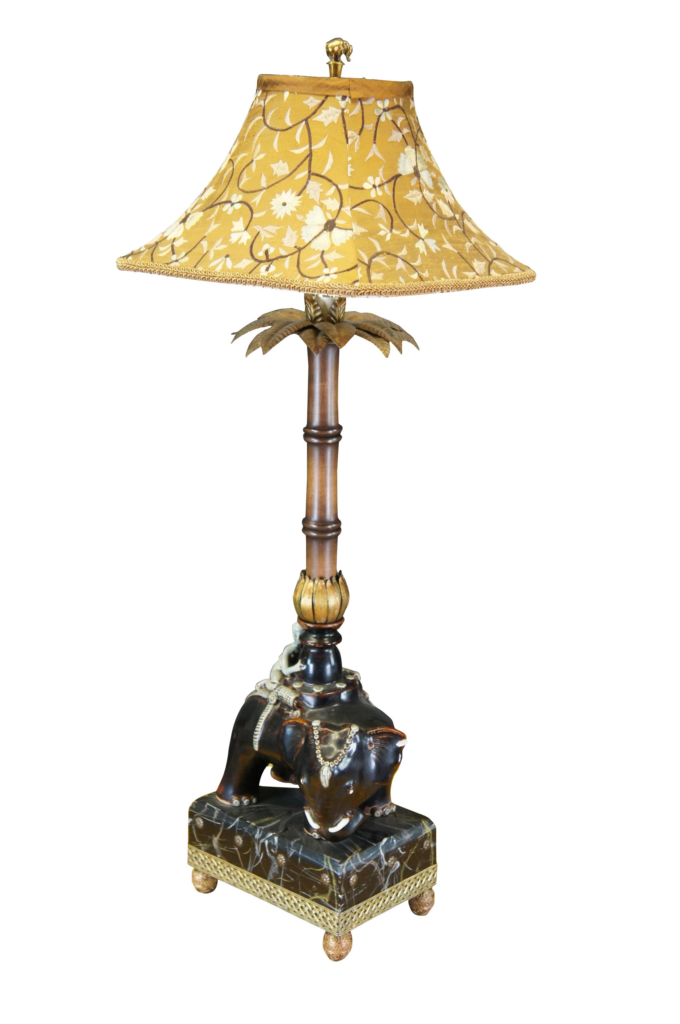 2 Raymond Waites For Tyndale (a division of Frederick Cooper) Oriental Table Lamps.  Features a true pair, (facing or apposing) Asian glazed elephants saddled with riders over a faux marbled beveled and filigree brass footed base.  Column is in the