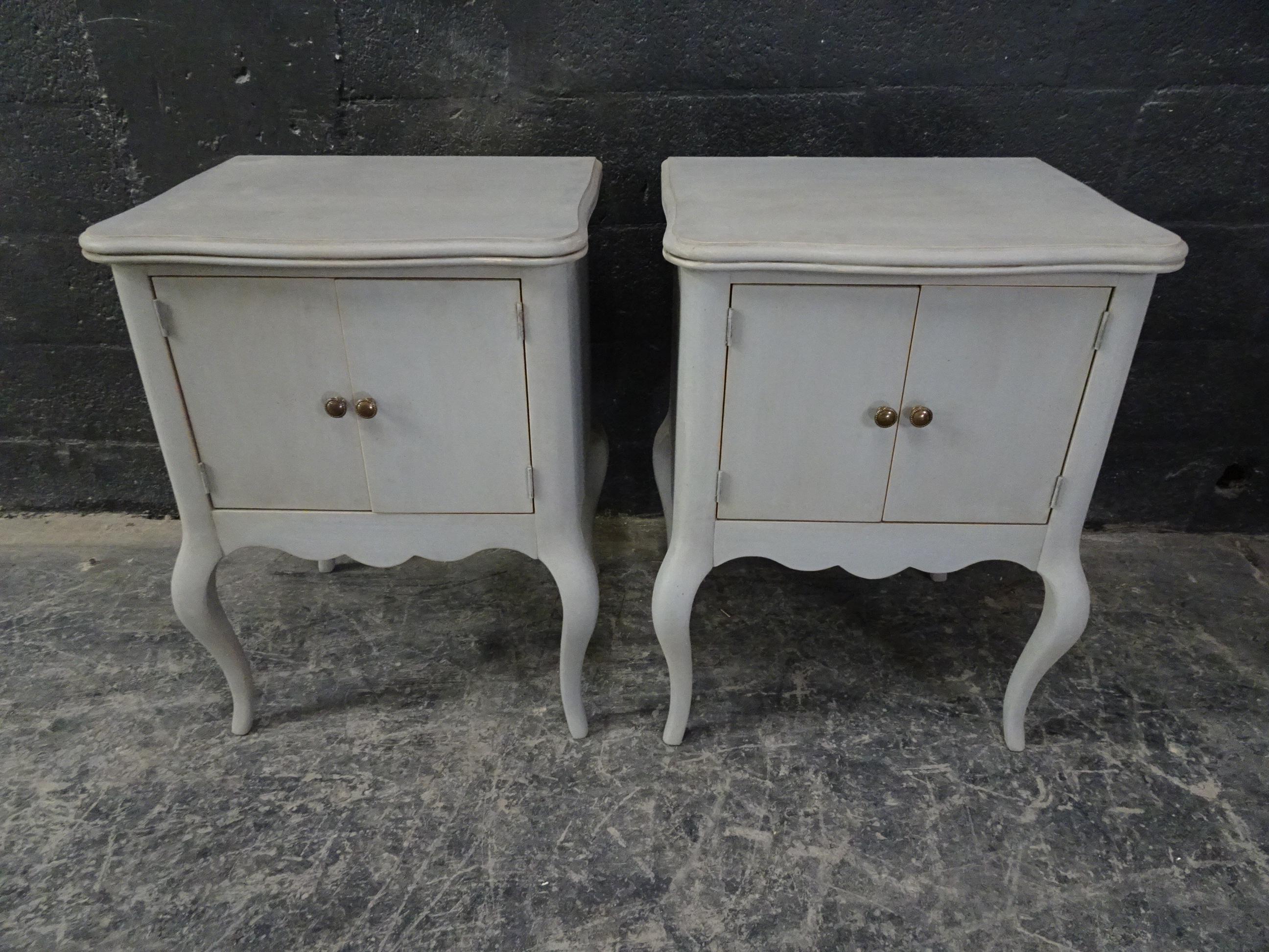This is a set of 2 Rococo style nightstands. They have been restored and repainted with milk paint.