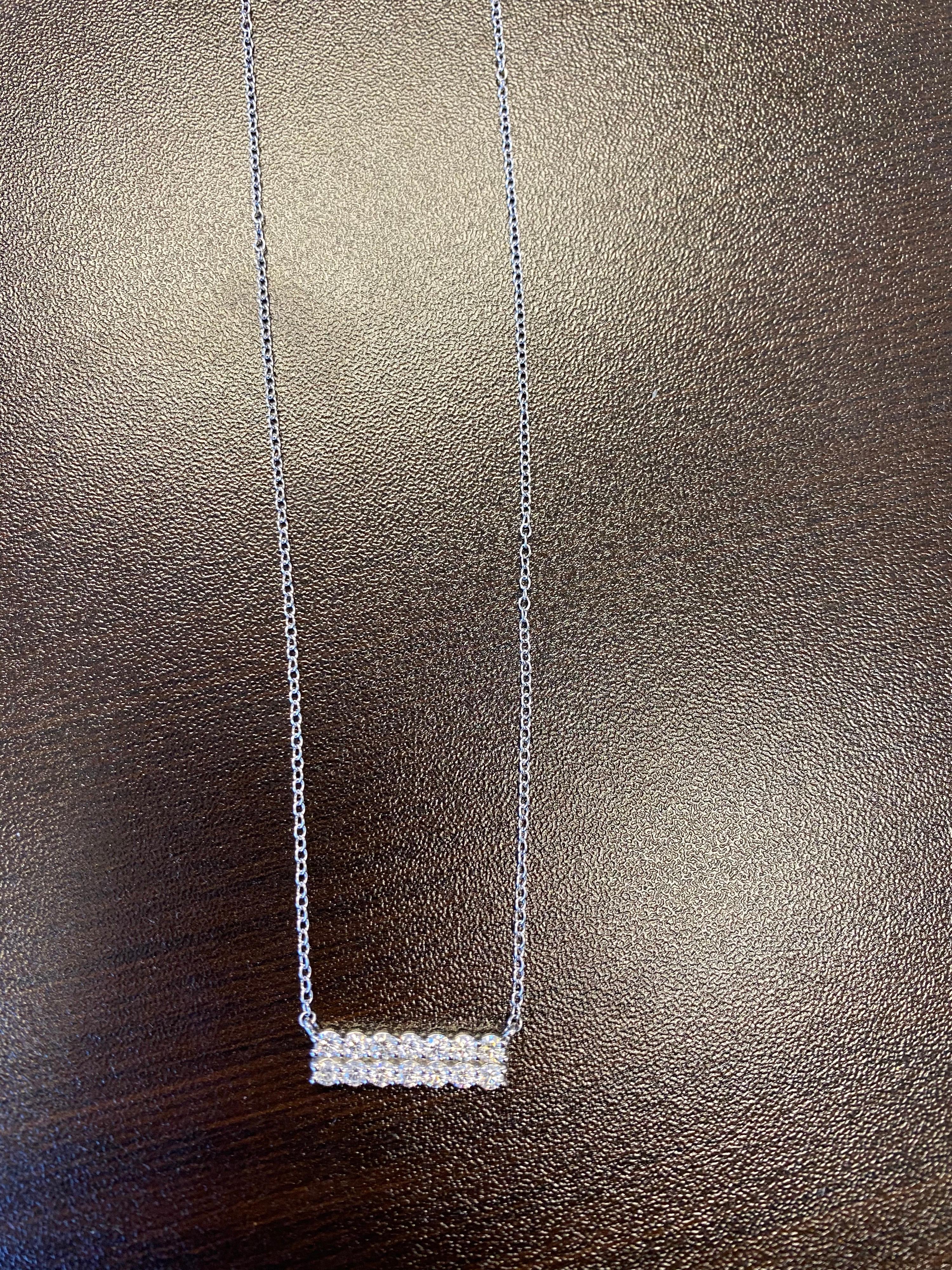 Diamond bar pendant set with 2 rows of diamonds in 14K white gold. The pendant is set with 14 stones, the total weight is 1 carat. The color of the stones are G, the clarity is SI1-SI2. The pendant is available in rose and yellow gold.