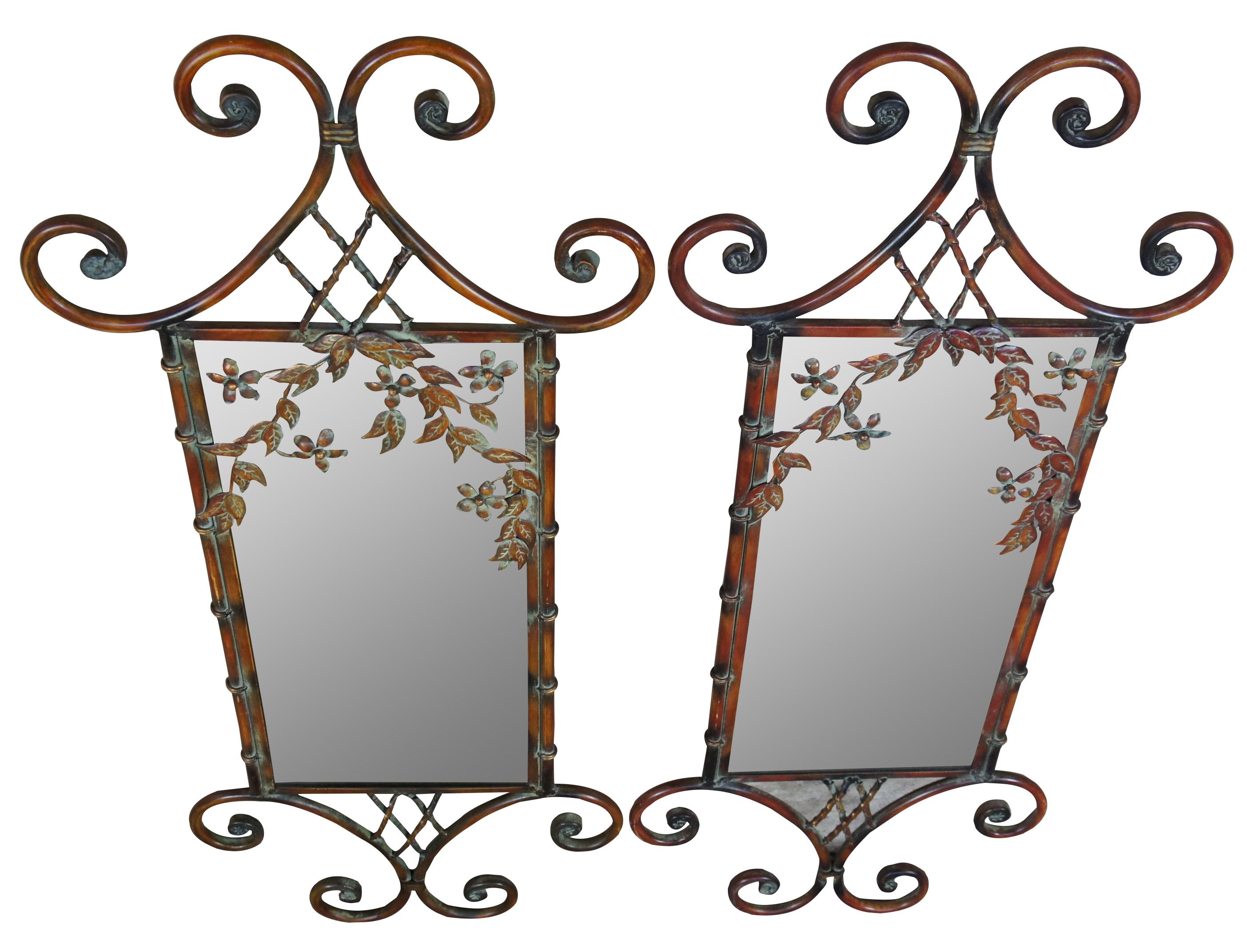Pair of two scrolled iron mirrors. Features a floral theme with faux bamboo, leaves and flowers. 
  

Mirror - 9