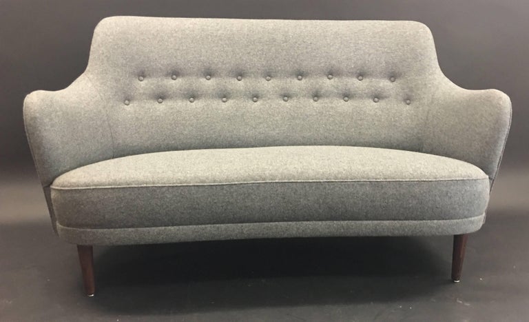 A beautifully reupholstered quality grey wool two-seat sofa by Carl Malmsten for O.H. Sjogren of Sweden.
A Classic comfortable scandy cool sofa.