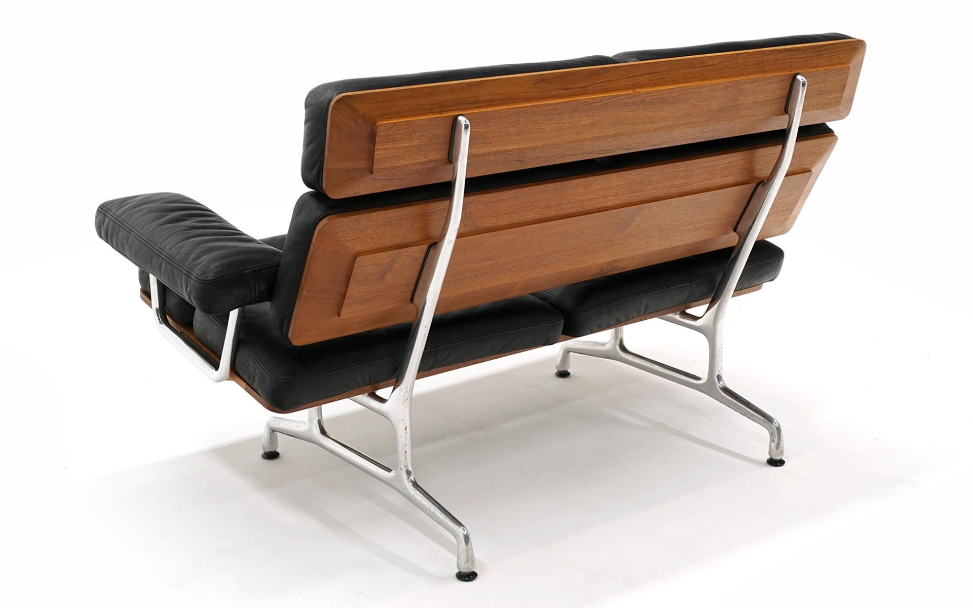 Aluminum 2 Seat Sofa Settee by Charles and Ray Eames, Teak and Black Leather For Sale