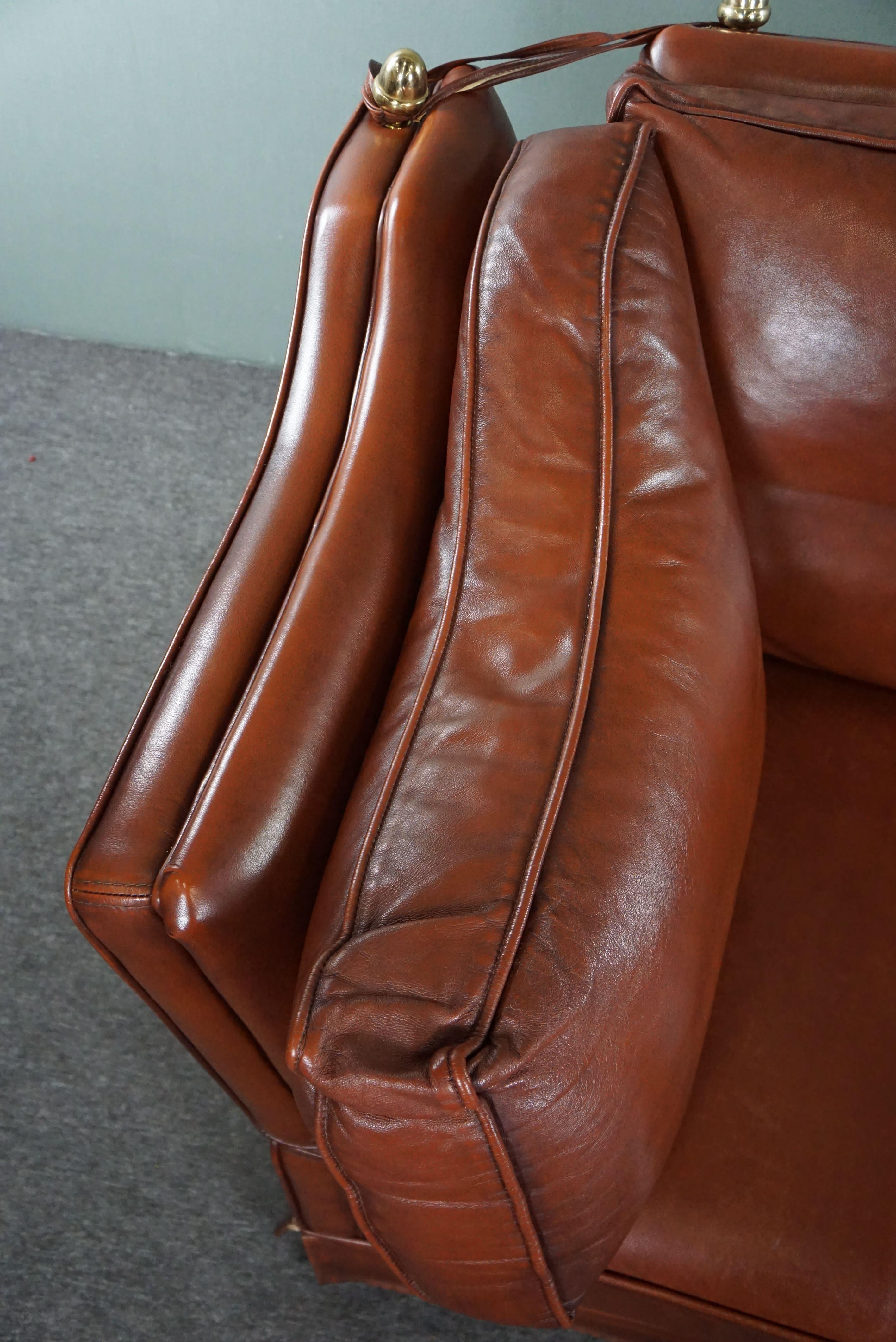 2-seater castle bench made of high-quality cognac-colored cowhide leather. For Sale 2