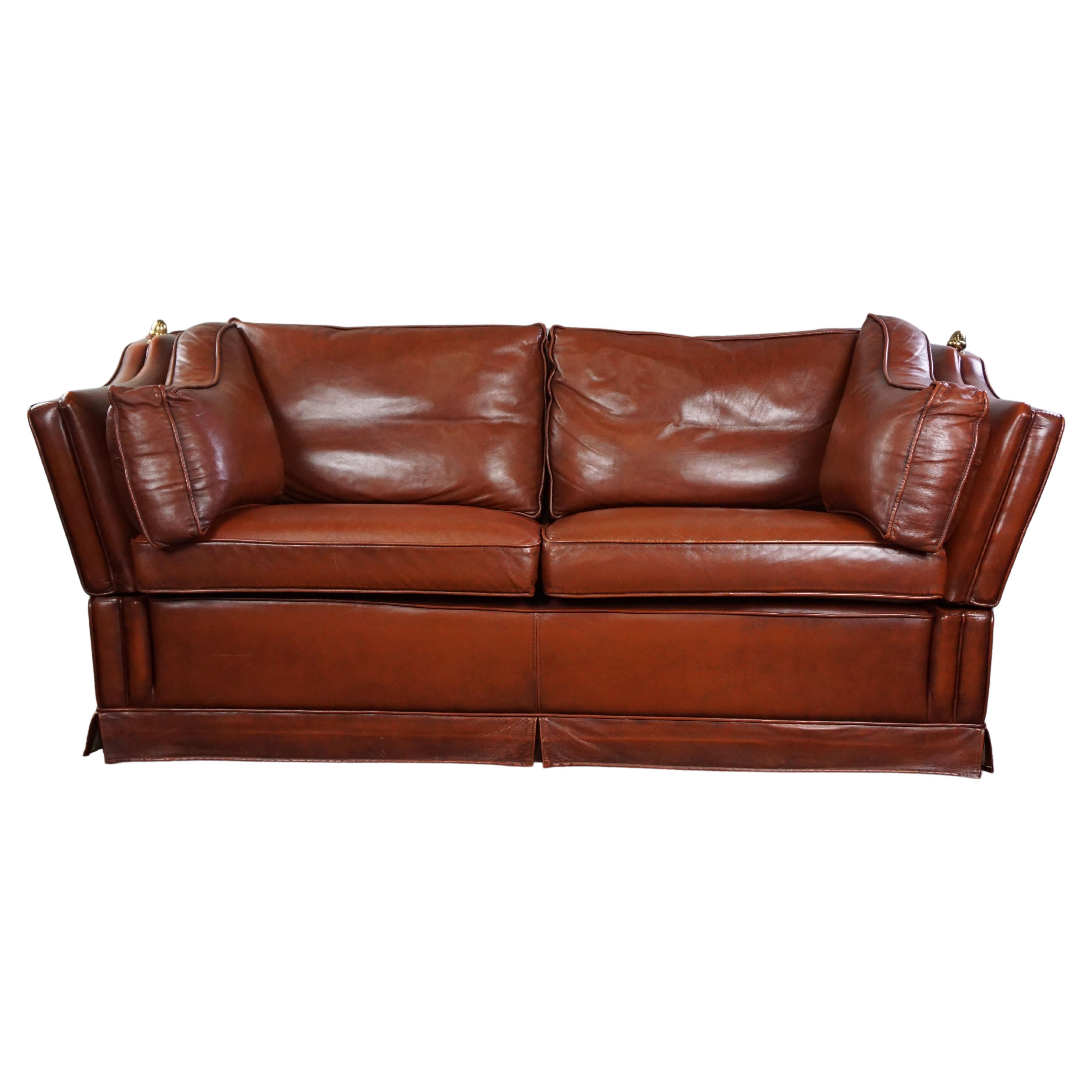 2-seater castle bench made of high-quality cognac-colored cowhide leather. For Sale