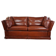Vintage 2-seater castle bench made of high-quality cognac-colored cowhide leather.
