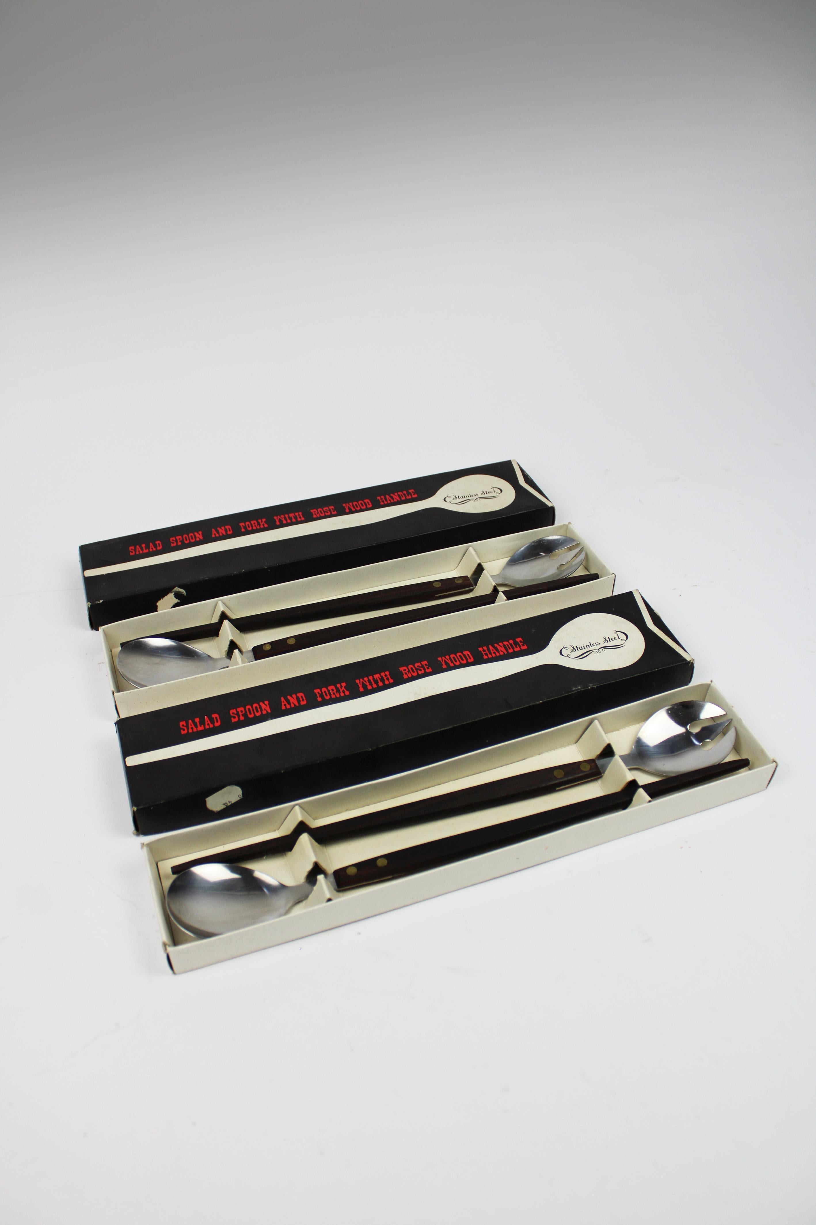 Introducing two exquisite sets of 1960s salad servers, featuring elegant rosewood handles and brass fittings paired with stainless steel utensils. These mid-century modern (MCM) pieces, made in Japan, are perfect for bringing a touch of retro