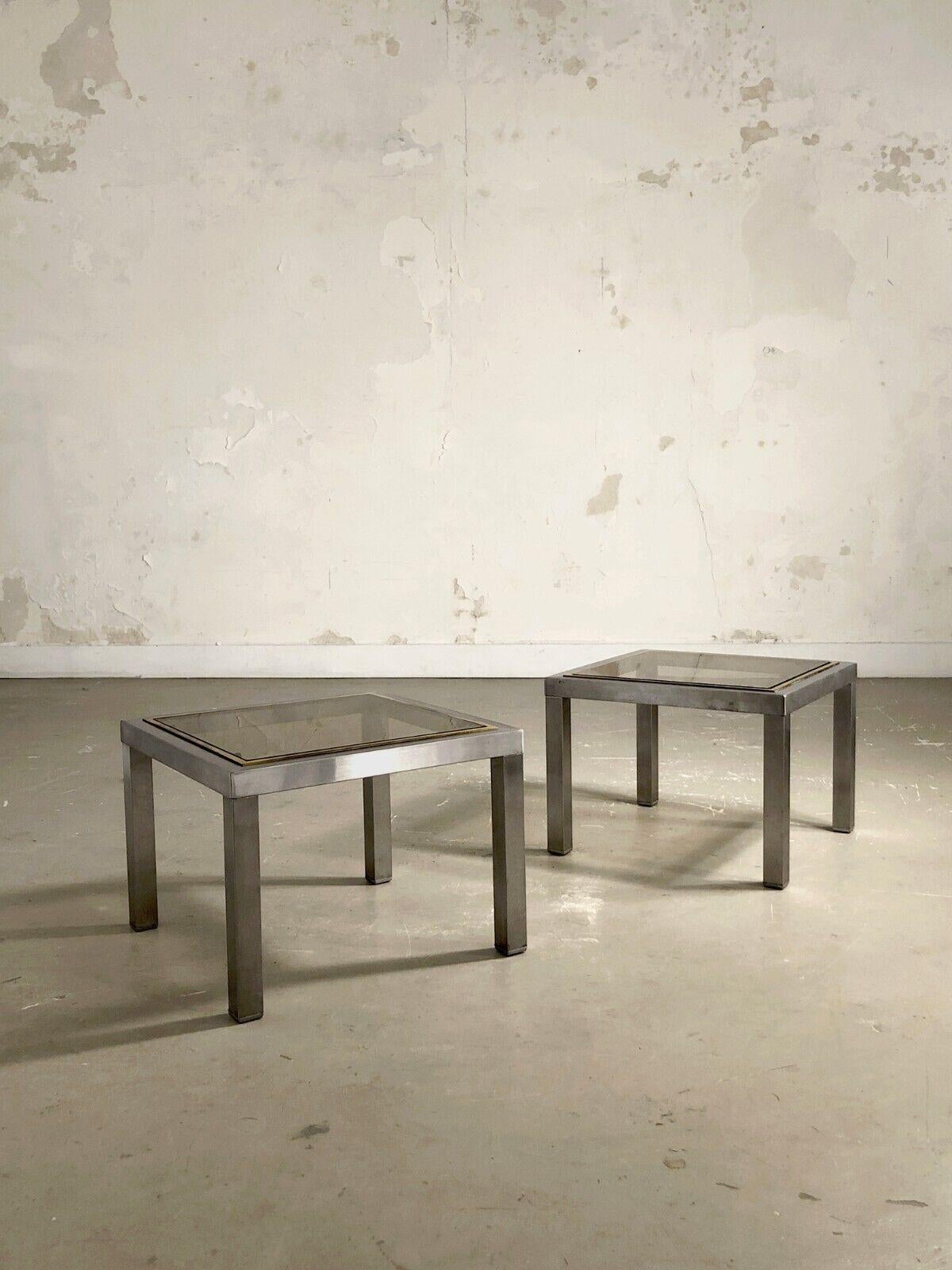 An elegant and rigorous pair of bedside tables, end tables or side tables, Post-Modernist, Radical, Constructivist, Shabby-Chic, geometric structure in brushed metal with a square section, square smoked glass tops surrounded by fine golden brass