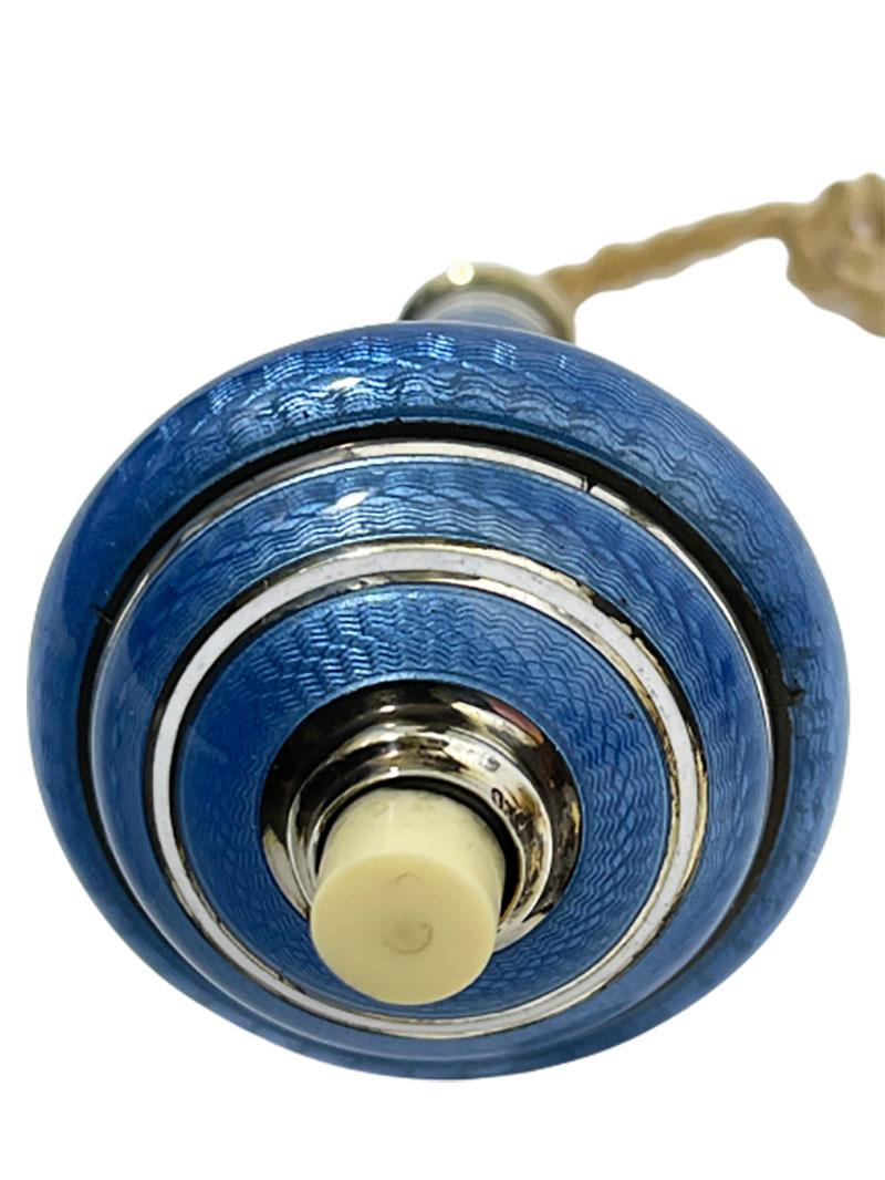 2 silver Guilloche enameled bell pushers

Silver bell pushers with silver purity of 935/1000 in Guilloche and enamel in blue.
A small round table push bell of 0.6 cm high without push button and 3.5 cm diagonal
The bells has their original old