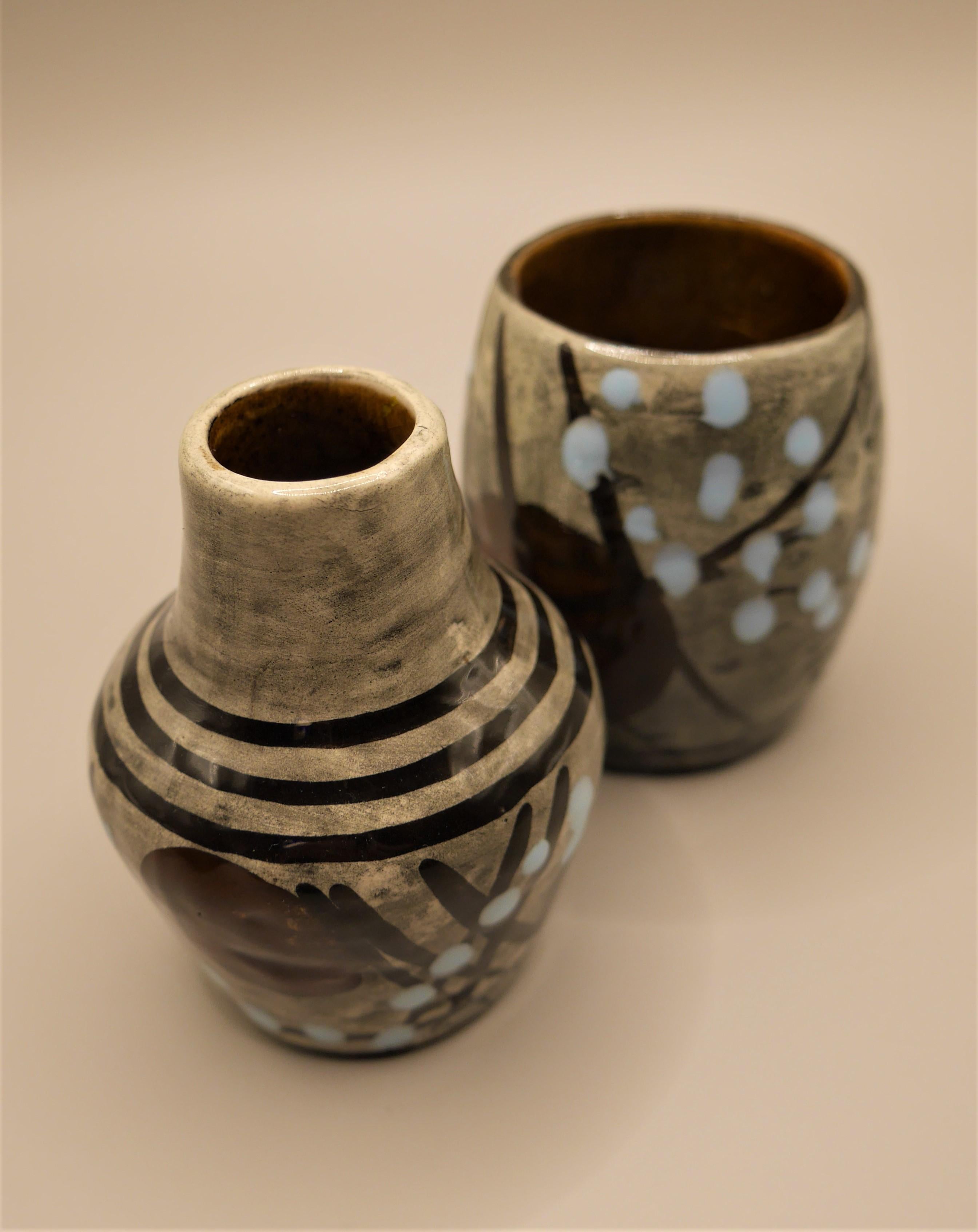 Two adorable small vases from Syco Keramik, Sweden. With a Japanese influenced pattern and glaze of abstract lines and dots in pale blue. 

Syco Keramik was a Swedish ceramics company, started in November 1945 by Arnold Wiig on Torskholmen in
