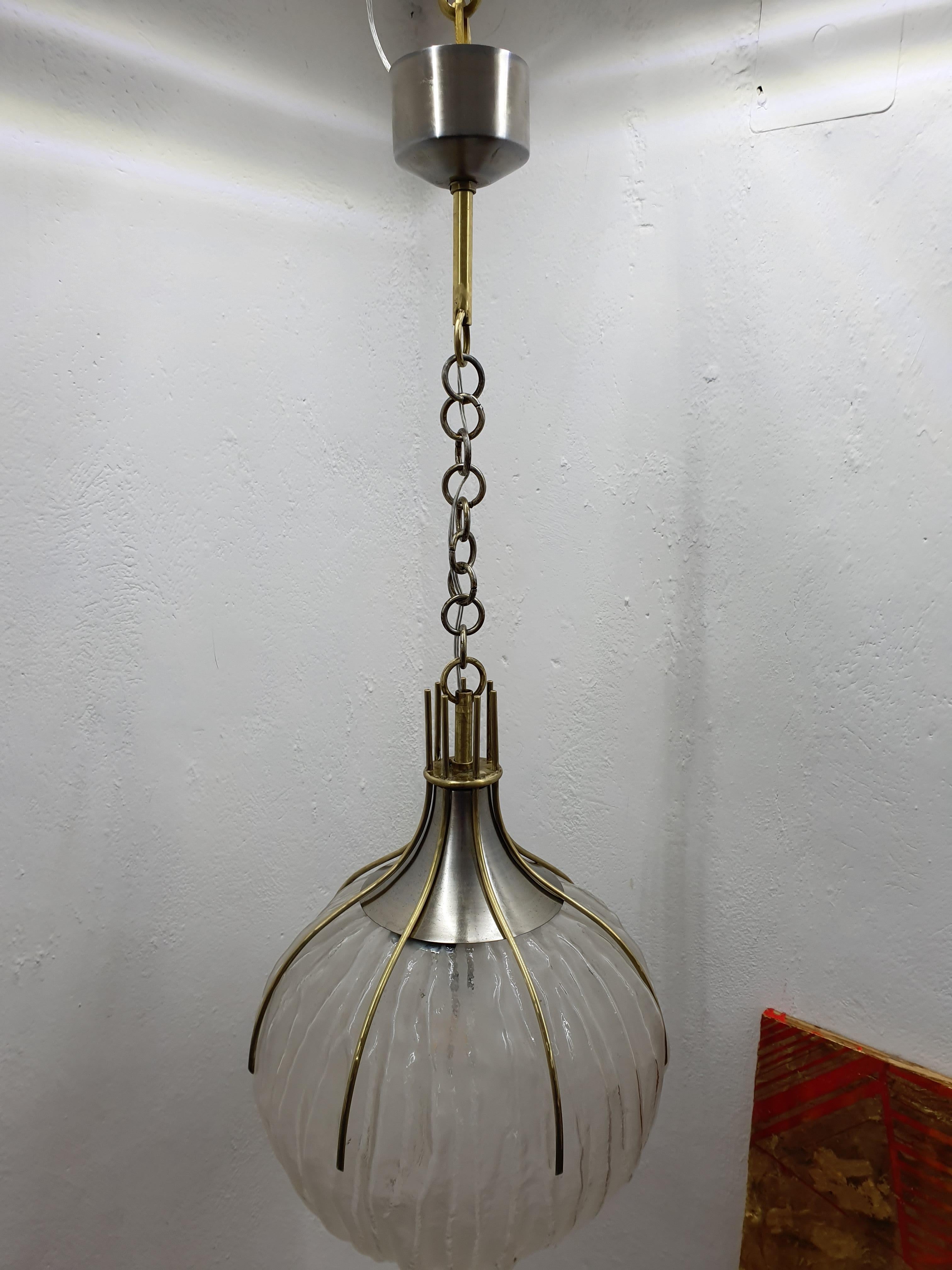 4 Space Age Chandelier designed by Robert Sonneman for Luci Milano, Italy, 1970
It consists of a moulded glass globe and brass and steel hardware.
Priced individually.