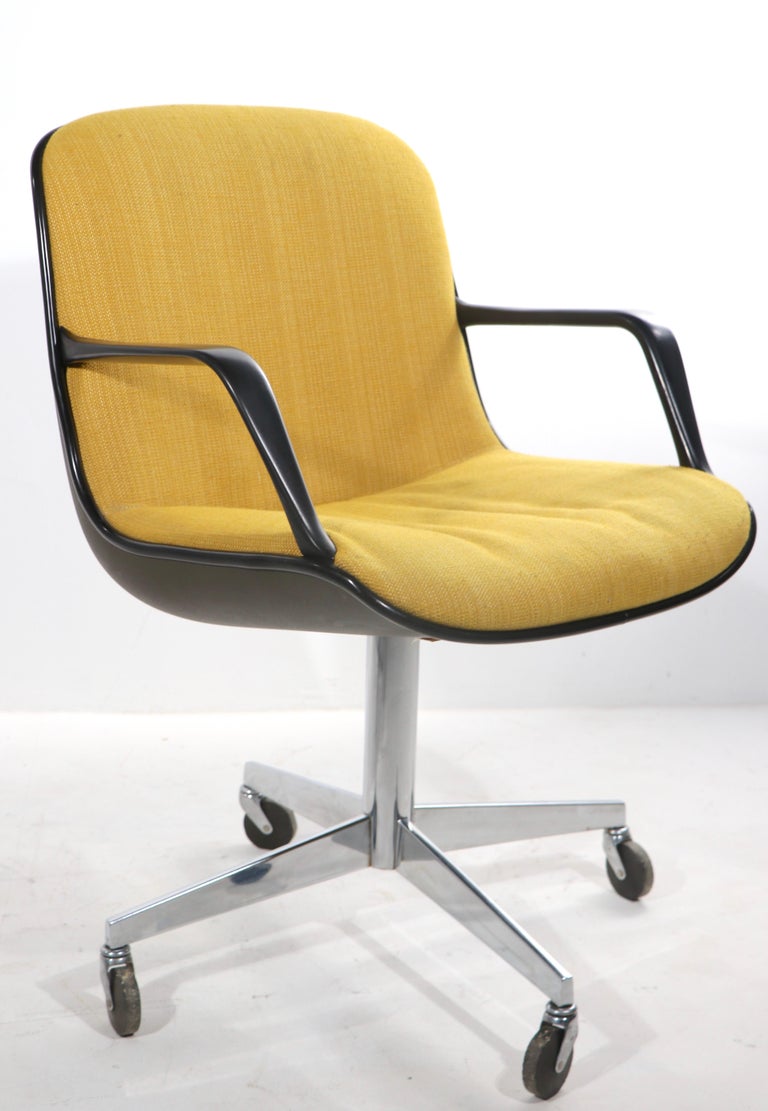 Sleek architectural, ergonomic design, Steelcase swivel office chair having a continuous seat and back, in yellow tweed fabric, dark gray plastic exterior shell, on chrome pedestal and star leg base, on wheel caster feet. It is in very good original