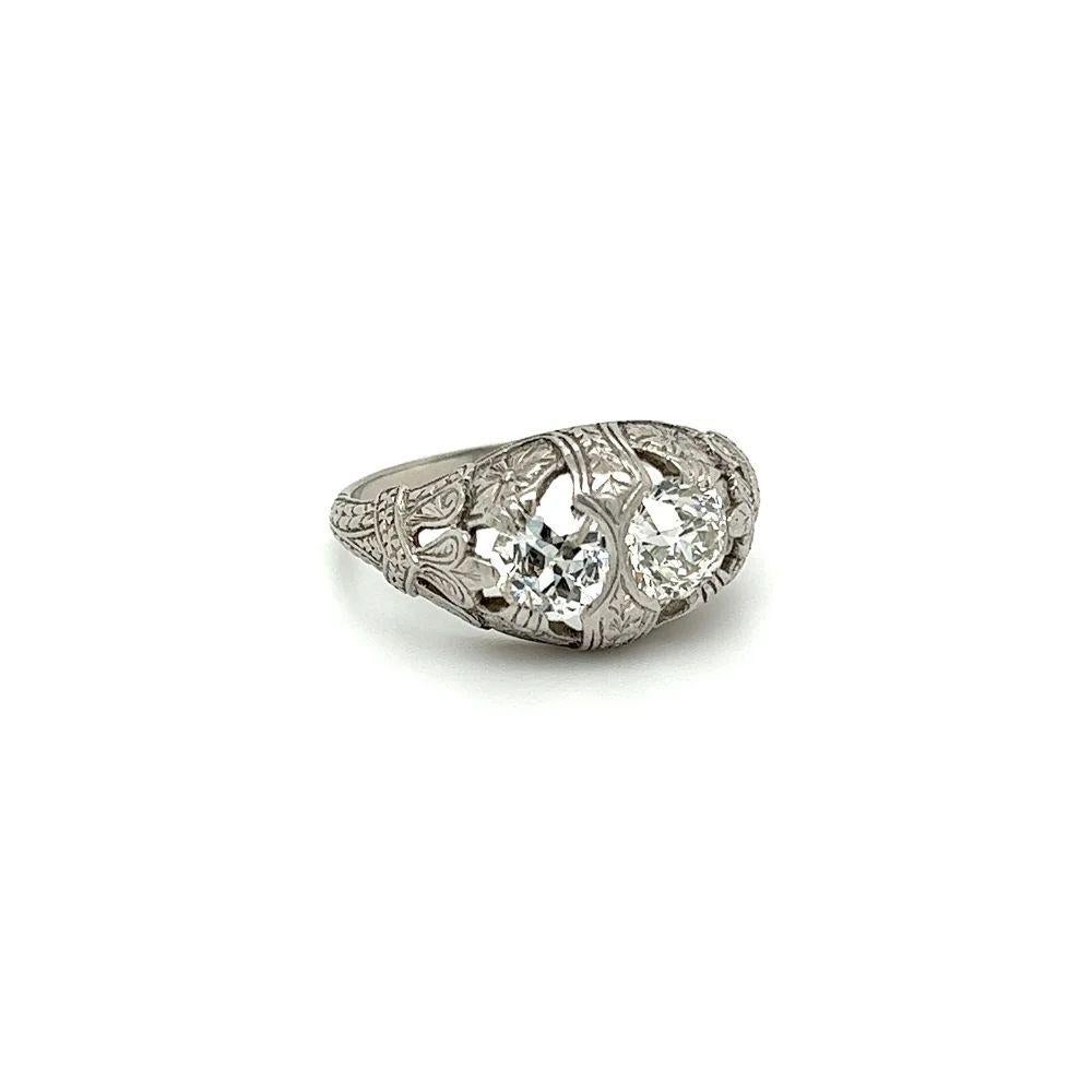 Simply Beautiful! Art Deco Two-Stone OEC Diamond Platinum Cocktail Ring. The 2 Diamonds weighing approx. 0.75 Carat and 0.65 Carat. Ring size: 6.5, we offer ring re-sizing. Beautifully Hand-crafted engraved Platinum mounting. The ring epitomizes