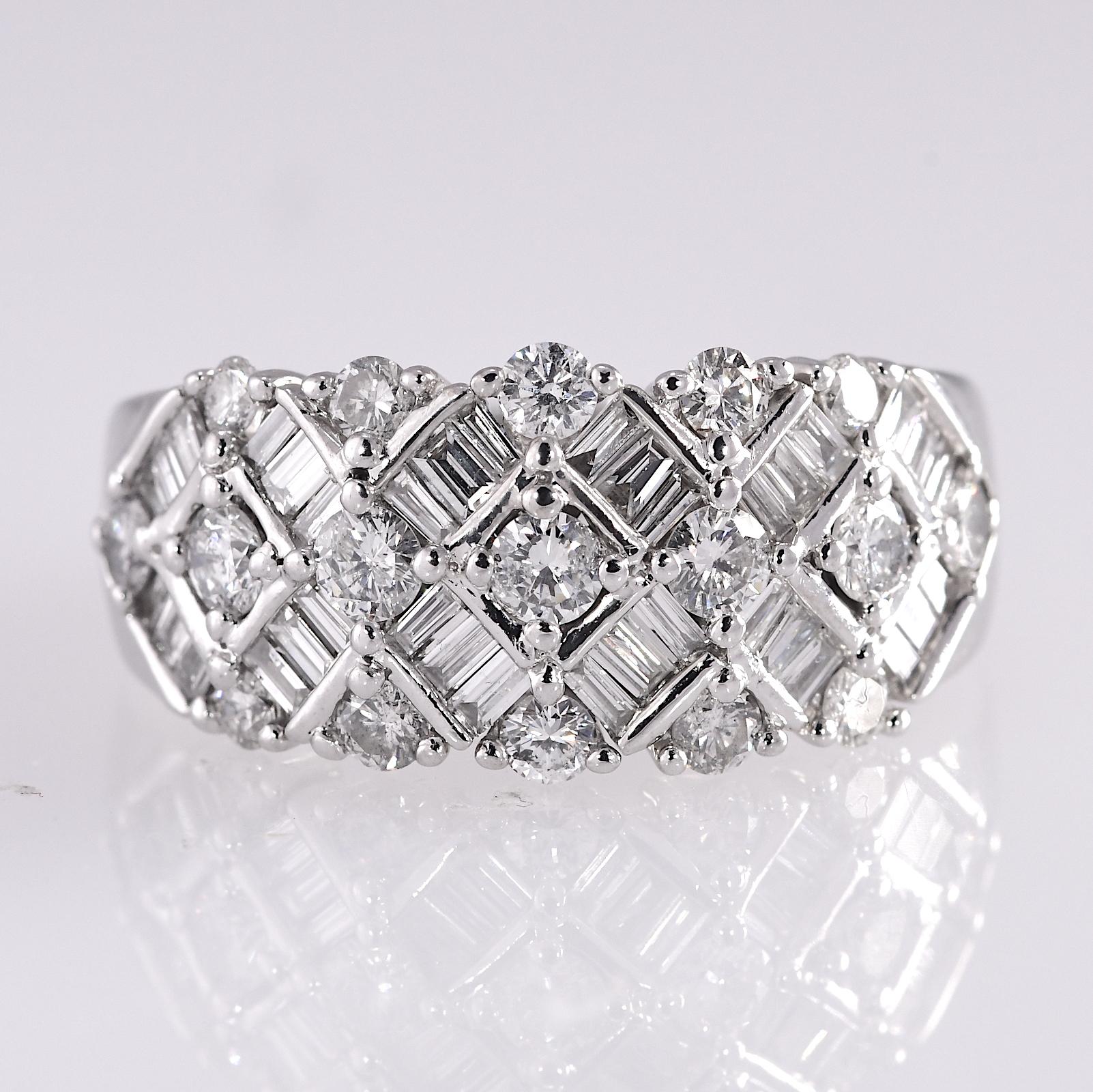 Alternating round and baguette diamonds set in a 14 karat white gold wide band. The total carat weight of the geometric design ring is 2.0 carat. 
The diamond quality is SI1-I2 H-J . The ring measures 7/16 inch long and 1 inch wide. The height is