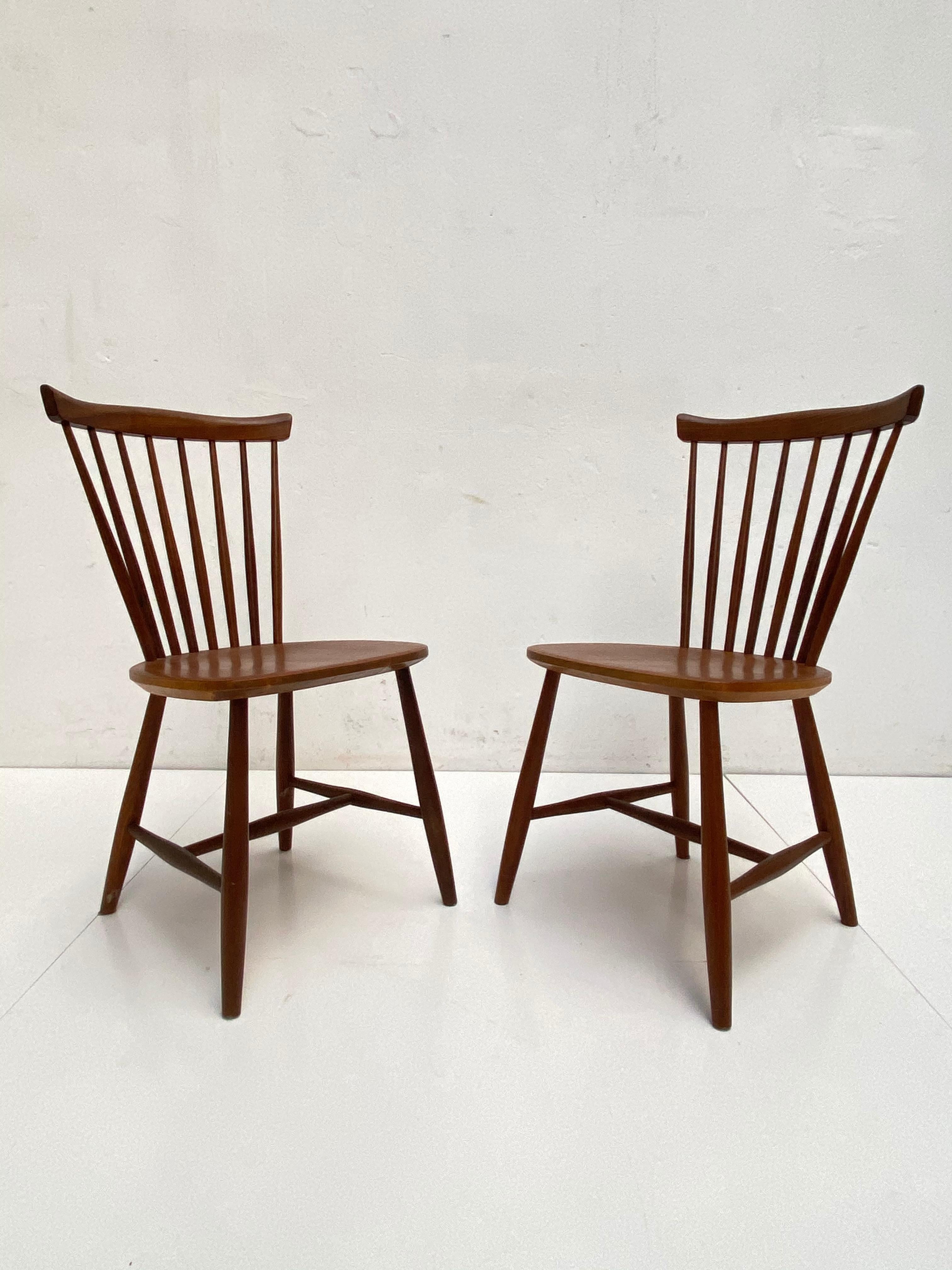 Pair of solid teak wood side chairs by Swedish designer Lena Larson for Nestor Sweden, distributed in The Netherlands by Pastoe in the 1950s

The chairs are in a remarkable good original vintage condition with a nice ageing patina

They are