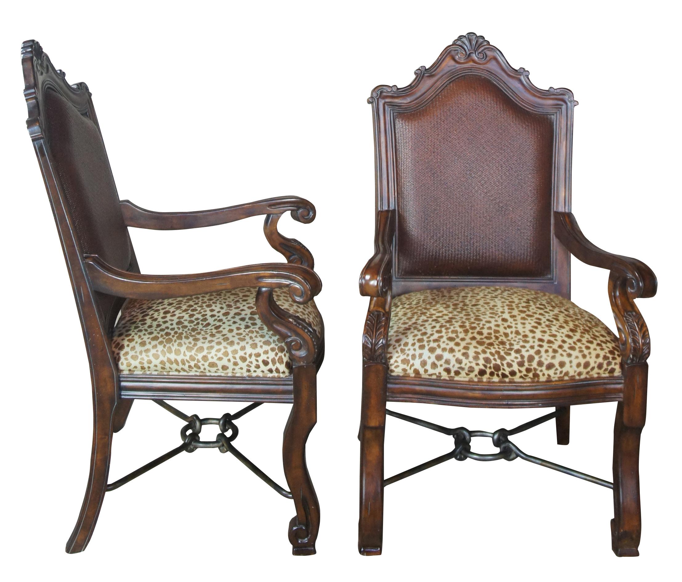 2 Thomasville Hemingway rustic old world leopard suede and rattan armchairs

Pair of Thomasville armchairs, part of the Hemingway collection. Features an old world Italian styling with scrolled acanthus carved arms, a rattan back and iron
