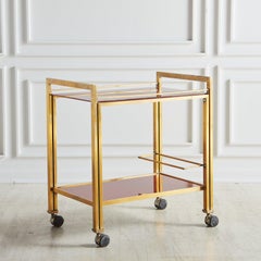 Carrito de bar de 2 niveles de vidrio rojo y latón de Guy Lefevre para Maison Jansen, Francia Años 60