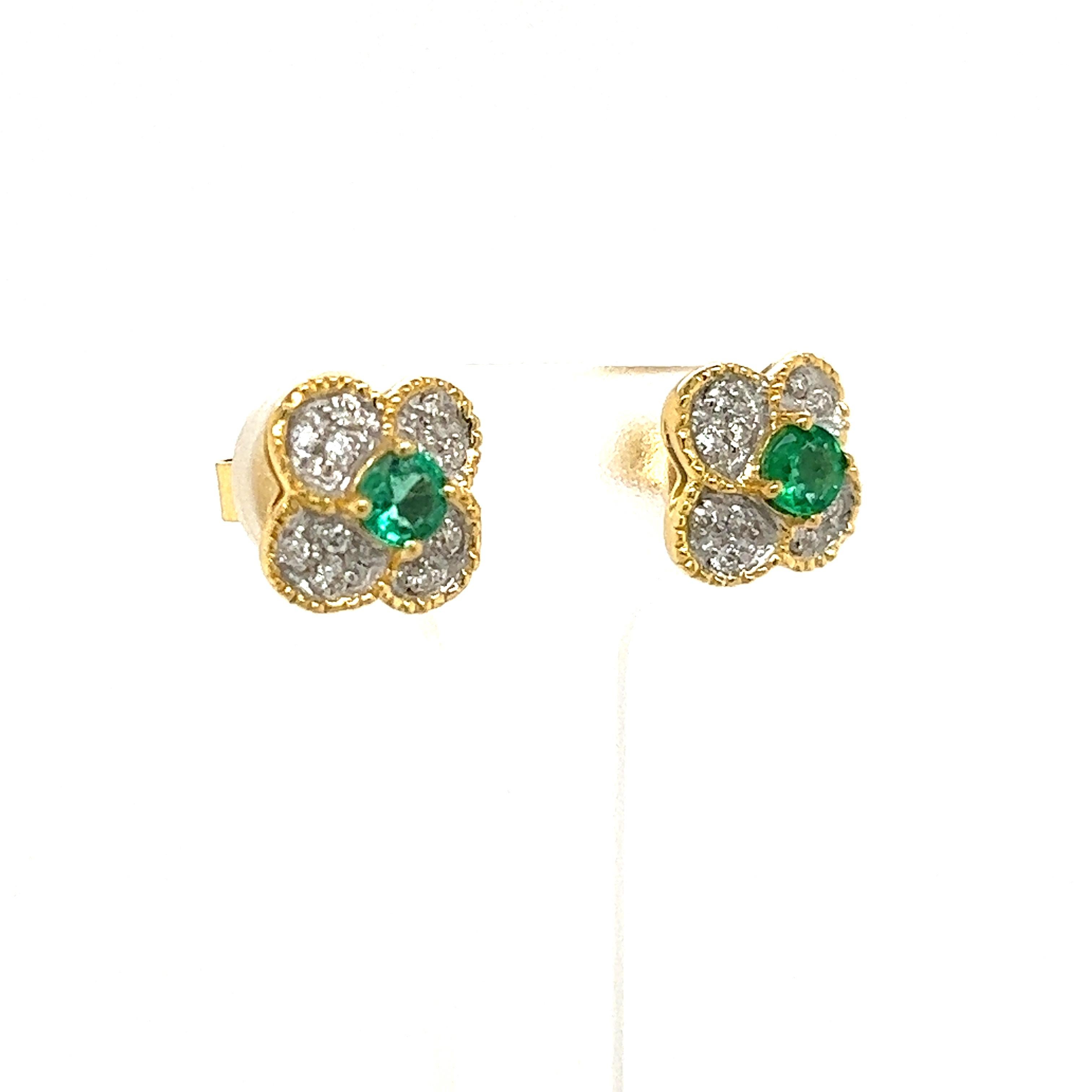 Pretty, dainty earrings with .40ct emeralds total weight and .18ct total weight of white diamonds, G color and VS clarity. A cute spin on everyday earrings set in 14k white and yellow gold.