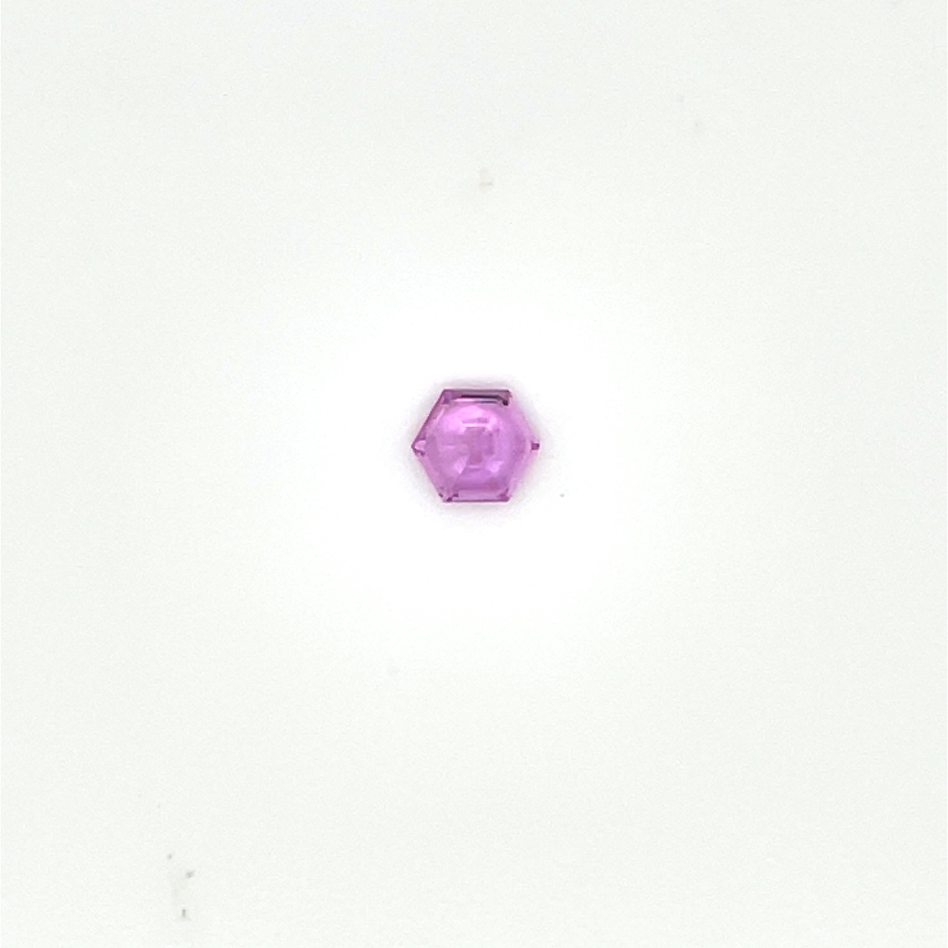 These two hexagon-cut pink sapphires (0.85 cts) captivate with their soft yet radiant hue, a symbol of love, compassion, and emotional balance. 

Mined from Madagascar, these sapphires are completely unheated, preserving their natural beauty and