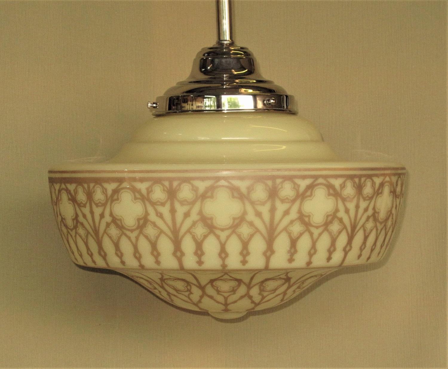 Priced for the pair.
Large and opulent fixtures out of a church in the Mid-west we were told. Divine Art Deco inspired design with trefoils, quatrefoils, Moorish arches, and a delicate latticework Surrounding the globe. The soft tan colored design