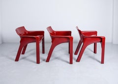 2 Gaudi Armchairs by Vico Magistretti for Artemide in Dark Red