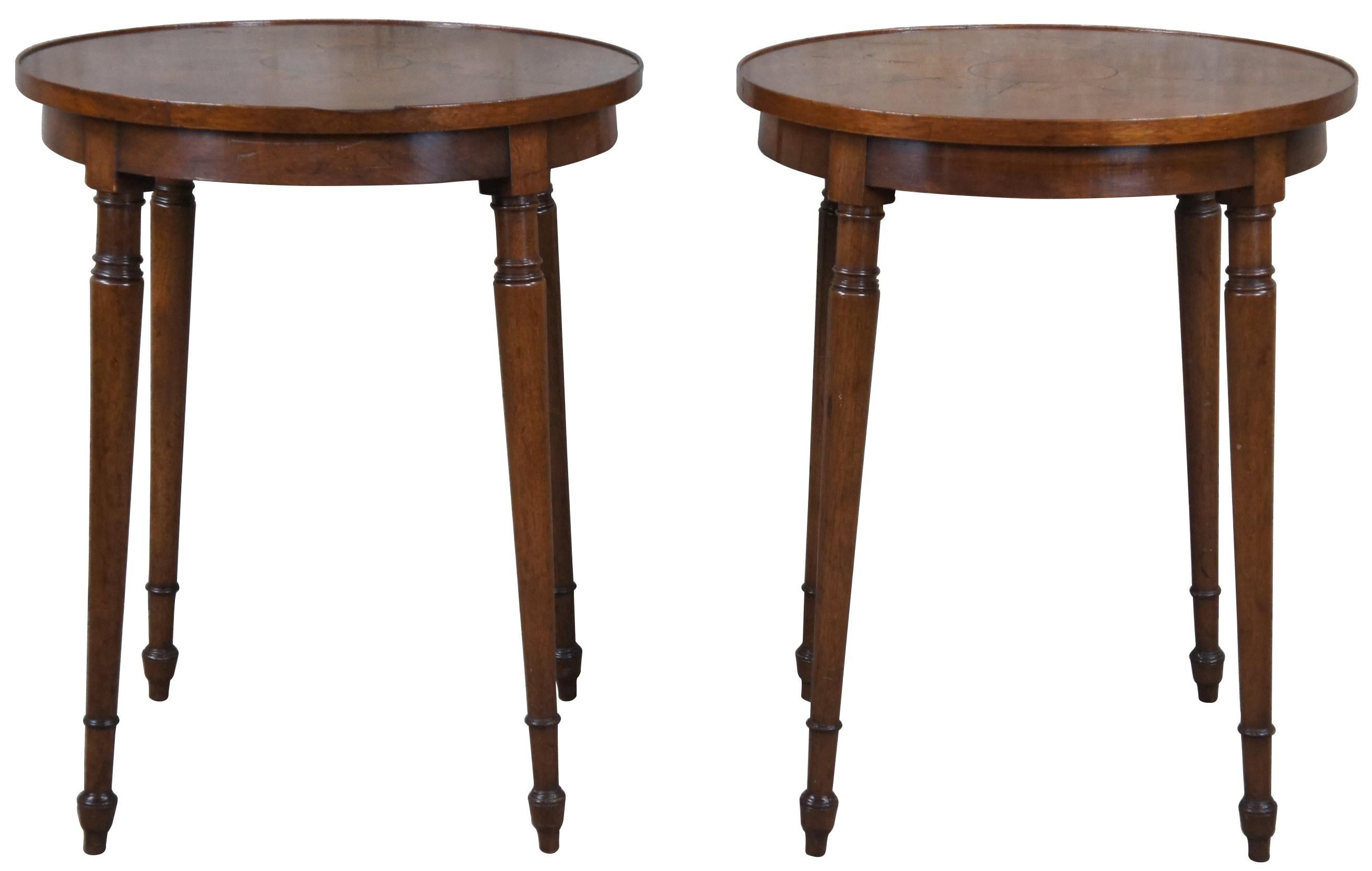 Beautiful pair of Old Colony Furniture side, end tables or nightstands. Made from walnut with a round matchbook inlaid top over flared and turned spindle legs.

Old Colony Furniture's roots go about to 1946 when they opened in Virginia. The