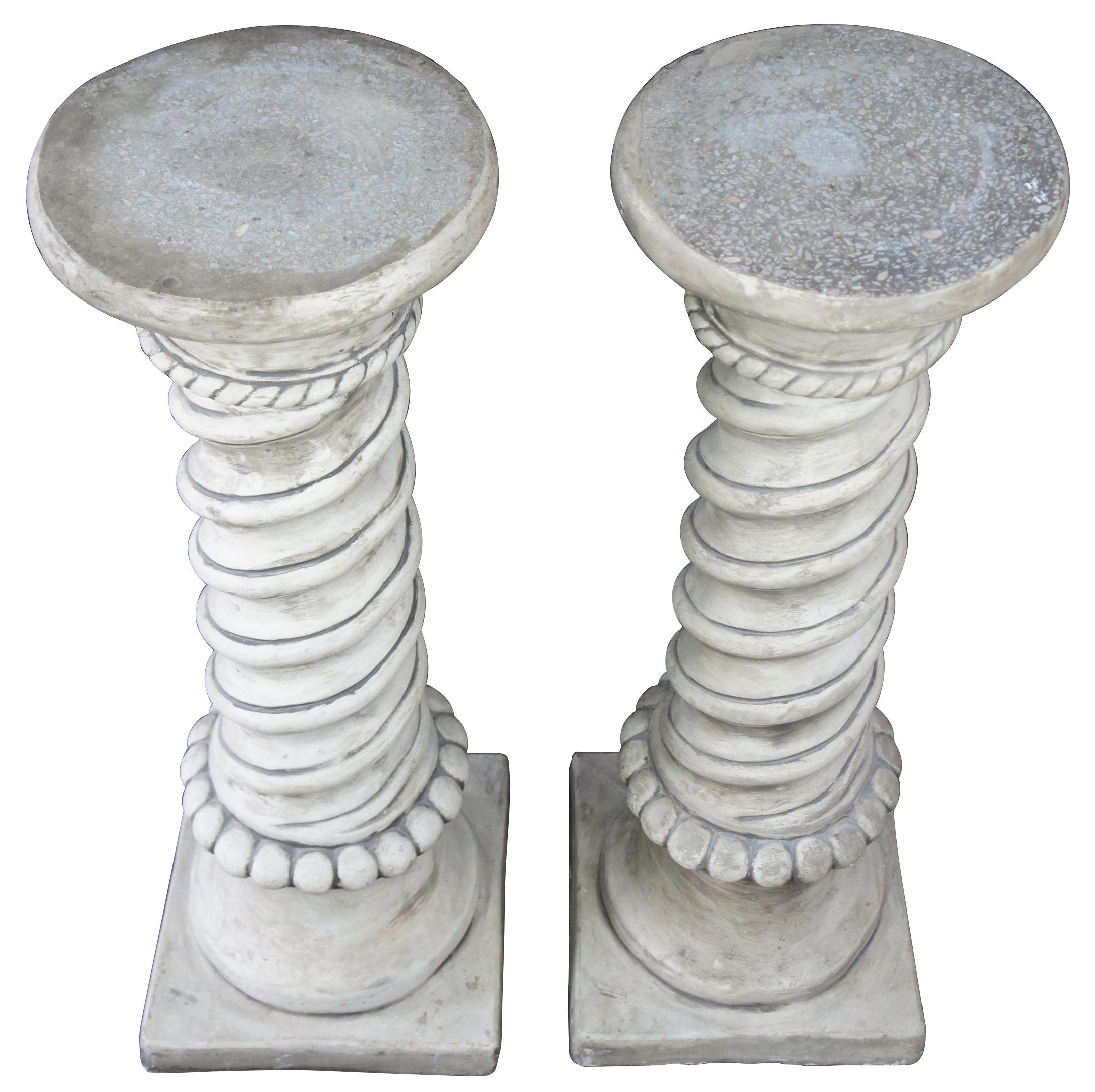 Late 20th century Victorian Revival barley twisted stone pedestals or plant stands. Each features a turned central column offest by a beaded and gadrooned design with a painted finish.
 
Top Diameter - 11.5